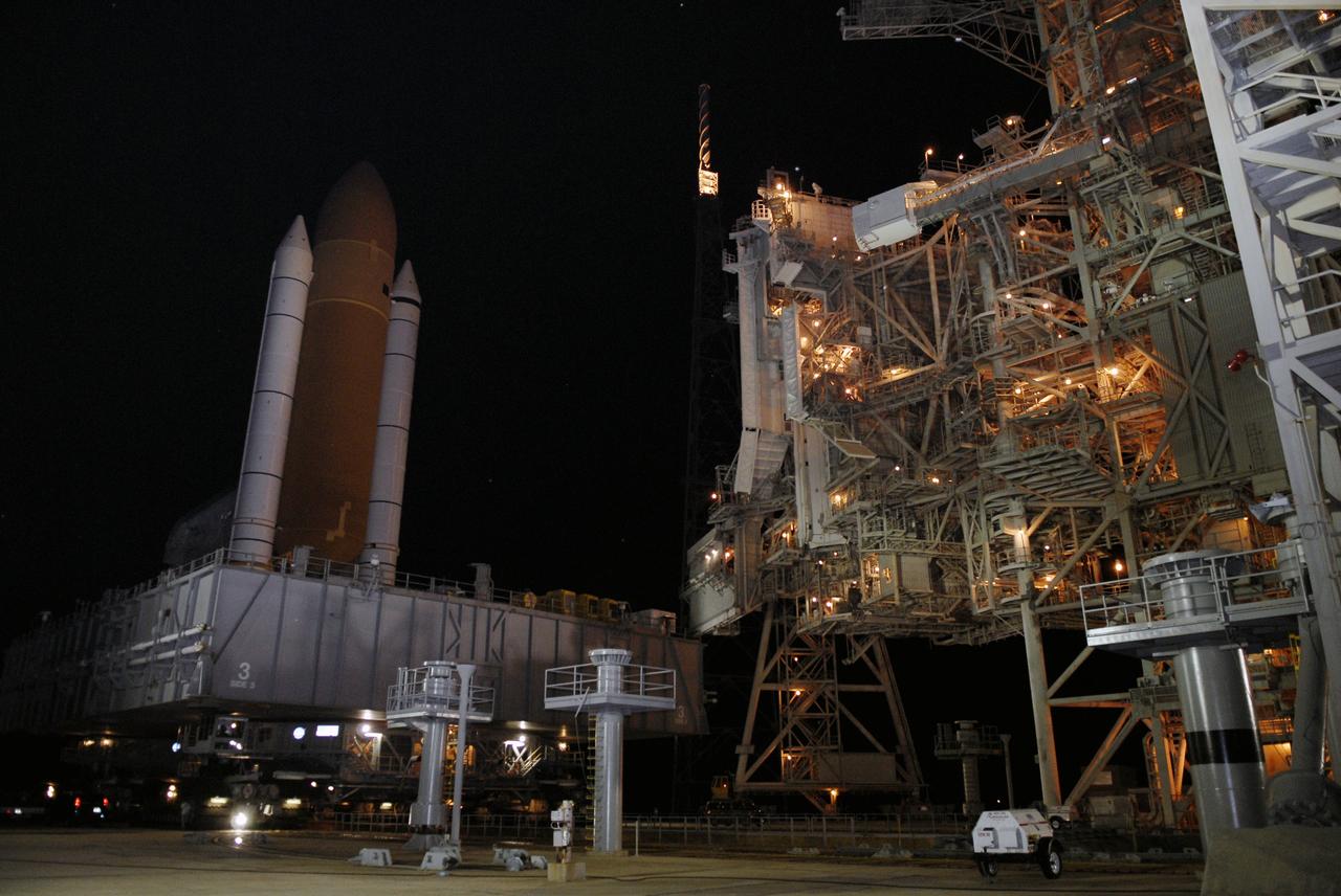 CAPE CANAVERAL, Fla. – At NASA's Kennedy Space Center in Florida, space shuttle Endeavour rolls off Launch Pad 39B for the 3.4-mile rollaround to Launch Pad 39A. Endeavour's external tank and solid rocket boosters are illuminated by lights on the pad's rotating service structure, at right. First motion was at 3:16 a.m. EDT. Endeavour was on standby on Pad 39B to be used in the unlikely event that a rescue mission was necessary during space shuttle Atlantis' STS-125 mission to NASA's Hubble Space Telescope. The payload on the STS-127 mission includes the Japan Aerospace Exploration Agency's Kibo Exposed Facility and the Experiment Logistics Module Exposed Section of the International Space Station. They will be installed on the Kibo laboratory already on the station. Launch of STS-127 is targeted for June 13. Photo credit: NASA/Kim Shiflett