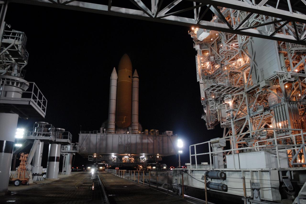 CAPE CANAVERAL, Fla. – At NASA's Kennedy Space Center in Florida, space shuttle Endeavour leaves Launch Pad 39B behind on its 3.4-mile rollaround to Launch Pad 39A. Endeavour's external tank and solid rocket boosters are illuminated by lights on the pad's rotating service structure, at right. First motion was at 3:16 a.m. EDT.  Endeavour was on standby on Pad 39B to be used in the unlikely event that a rescue mission was necessary during space shuttle Atlantis' STS-125 mission to NASA's Hubble Space Telescope. The payload on the STS-127 mission includes the Japan Aerospace Exploration Agency's Kibo Exposed Facility and the Experiment Logistics Module Exposed Section of the International Space Station. They will be installed on the Kibo laboratory already on the station. Launch of STS-127 is targeted for June 13. Photo credit: NASA/Kim Shiflett