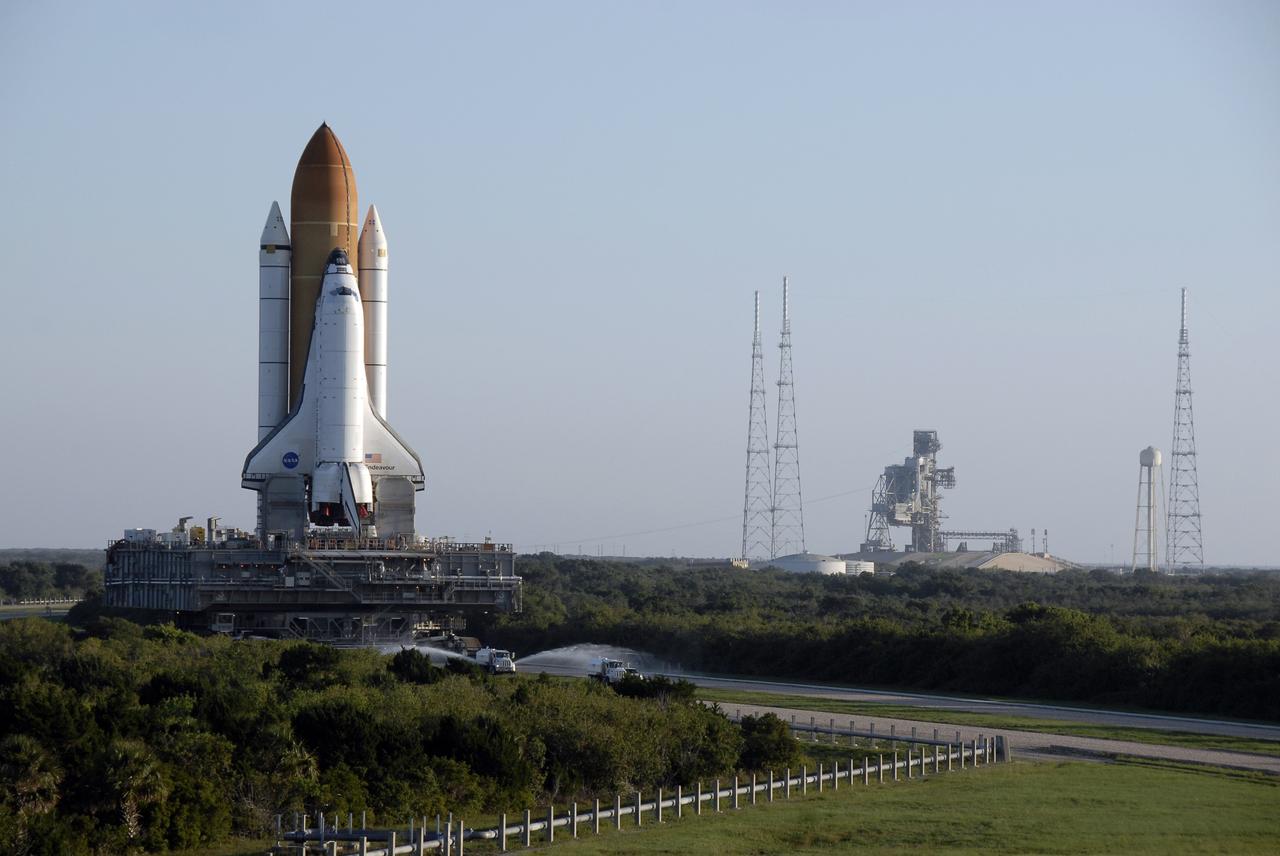 CAPE CANAVERAL, Fla. – Early morning at NASA's Kennedy Space Center in Florida finds space shuttle Endeavour departing Launch Pad 39B on its 3.4-mile rollaround to Launch Pad 39A. First motion was at 3:16 a.m. EDT. Three lightning towers have been erected already on Pad 39B, at right, to support the new launch vehicles in NASA's Constellation Program. Endeavour was on standby on Pad 39B to be used in the unlikely event that a rescue mission was necessary during space shuttle Atlantis' STS-125 mission to NASA's Hubble Space Telescope. The payload on the STS-127 mission includes the Japan Aerospace Exploration Agency's Kibo Exposed Facility and the Experiment Logistics Module Exposed Section of the International Space Station. They will be installed on the Kibo laboratory already on the station. Launch of STS-127 is targeted for June 13. Photo credit: NASA/Kim Shiflett