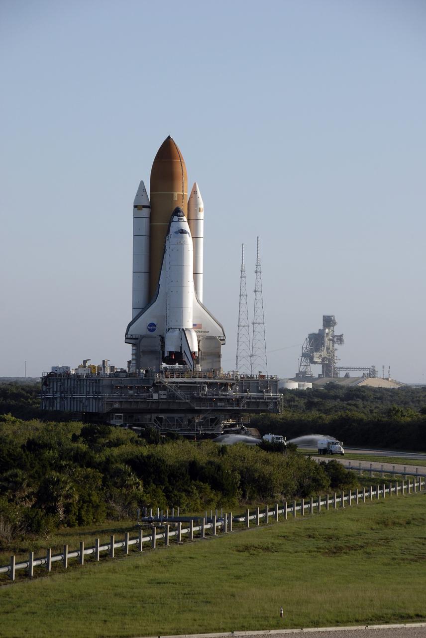 CAPE CANAVERAL, Fla. – Early morning at NASA's Kennedy Space Center in Florida finds space shuttle Endeavour well on its way from Launch Pad 39B, at right, on its 3.4-mile rollaround to Launch Pad 39A. First motion was at 3:16 a.m. EDT.  Endeavour was on standby on Pad 39B to be used in the unlikely event that a rescue mission was necessary during space shuttle Atlantis' STS-125 mission to NASA's Hubble Space Telescope. The payload on the STS-127 mission includes the Japan Aerospace Exploration Agency's Kibo Exposed Facility and the Experiment Logistics Module Exposed Section of the International Space Station. They will be installed on the Kibo laboratory already on the station. Launch of STS-127 is targeted for June 13. Photo credit: NASA/Kim Shiflett