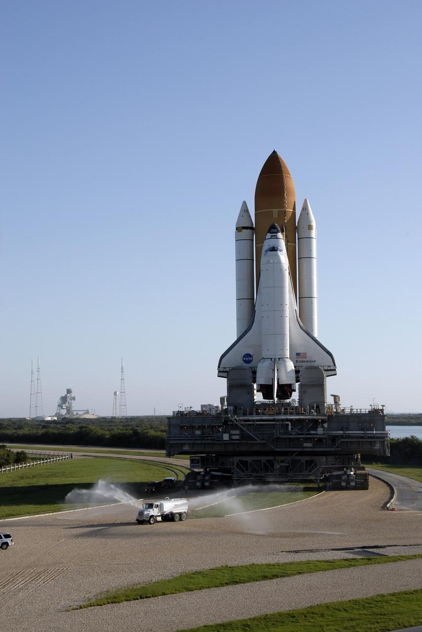CAPE CANAVERAL, Fla. – At NASA's Kennedy Space Center in Florida, space shuttle Endeavour reaches the fork in the crawlerway between Launch Pad 39B, at left, and Launch Pad 39A.  First motion of the 3.4-mile rollaround was at 3:16 a.m. EDT.  Endeavour was on standby on Pad 39B to be used in the unlikely event that a rescue mission was necessary during space shuttle Atlantis' STS-125 mission to NASA's Hubble Space Telescope. The payload on the STS-127 mission includes the Japan Aerospace Exploration Agency's Kibo Exposed Facility and the Experiment Logistics Module Exposed Section of the International Space Station. They will be installed on the Kibo laboratory already on the station. Launch of STS-127 is targeted for June 13. Photo credit: NASA/Kim Shiflett