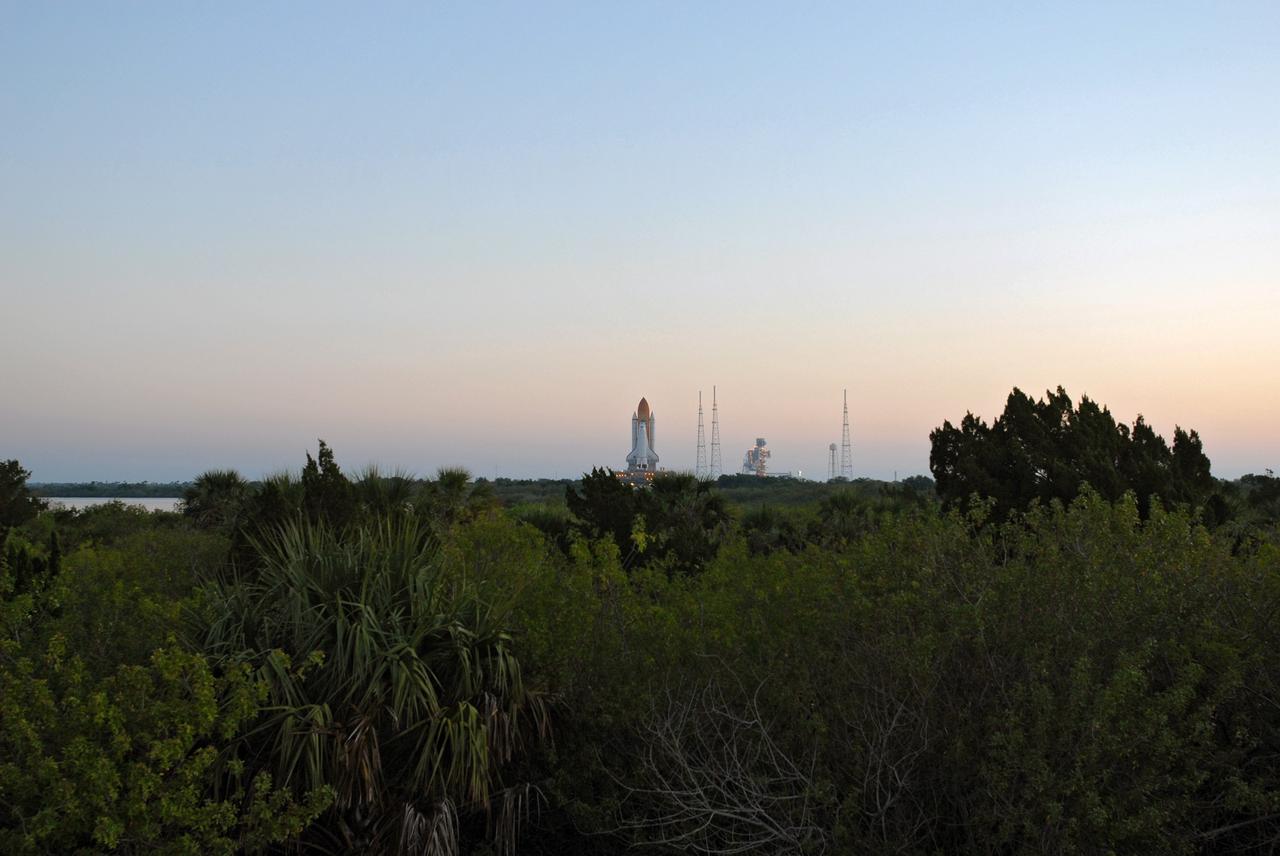CAPE CANAVERAL, Fla. – Early morning at NASA's Kennedy Space Center in Florida finds space shuttle Endeavour well on its way from Launch Pad 39B, at right, on its 3.4-mile rollaround to Launch Pad 39A. First motion was at 3:16 a.m. EDT.  Endeavour was on standby on Pad 39B to be used in the unlikely event that a rescue mission was necessary during space shuttle Atlantis' STS-125 mission to NASA's Hubble Space Telescope. The payload on the STS-127 mission includes the Japan Aerospace Exploration Agency's Kibo Exposed Facility and the Experiment Logistics Module Exposed Section of the International Space Station. They will be installed on the Kibo laboratory already on the station. Launch of STS-127 is targeted for June 13. Photo credit: NASA/Jim Grossmann