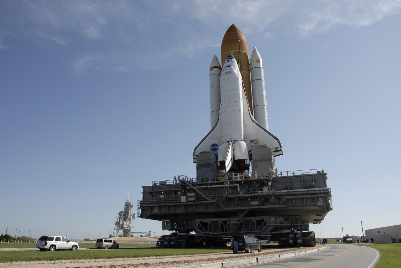 CAPE CANAVERAL, Fla. – At NASA's Kennedy Space Center in Florida, space shuttle Endeavour approaches Launch Pad 39A, in the background at left.   First motion of the 3.4-mile rollaround from Launch Pad 39B was at 3:16 a.m. EDT.  Endeavour was on standby on Pad 39B to be used in the unlikely event that a rescue mission was necessary during space shuttle Atlantis' STS-125 mission to NASA's Hubble Space Telescope. The payload on Endeavour's next mission, STS-127, includes the Japan Aerospace Exploration Agency's Kibo Exposed Facility and the Experiment Logistics Module Exposed Section of the International Space Station. They will be installed on the Kibo laboratory already on the station. Launch of STS-127 is targeted for June 13. Photo credit: NASA/Kim Shiflett