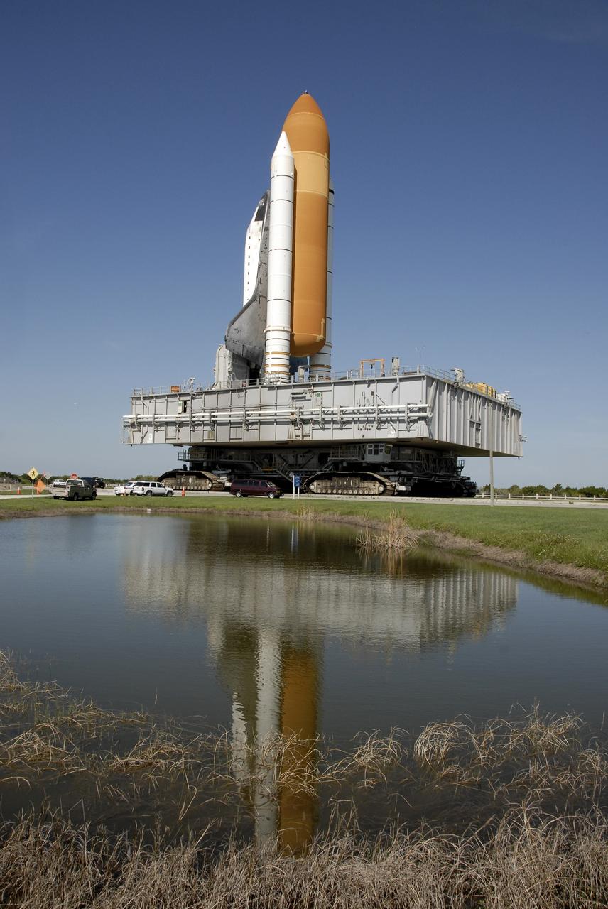 CAPE CANAVERAL, Fla. – At NASA's Kennedy Space Center in Florida, space shuttle Endeavour is reflected in standing water near the crawlerway on its trek to Launch Pad 39A.   First motion of the 3.4-mile rollaround from Launch Pad 39B was at 3:16 a.m. EDT.  Endeavour was on standby on Pad 39B to be used in the unlikely event that a rescue mission was necessary during space shuttle Atlantis' STS-125 mission to NASA's Hubble Space Telescope. The payload on Endeavour's next mission, STS-127, includes the Japan Aerospace Exploration Agency's Kibo Exposed Facility and the Experiment Logistics Module Exposed Section of the International Space Station. They will be installed on the Kibo laboratory already on the station. Launch of STS-127 is targeted for June 13. Photo credit: NASA/Kim Shiflett