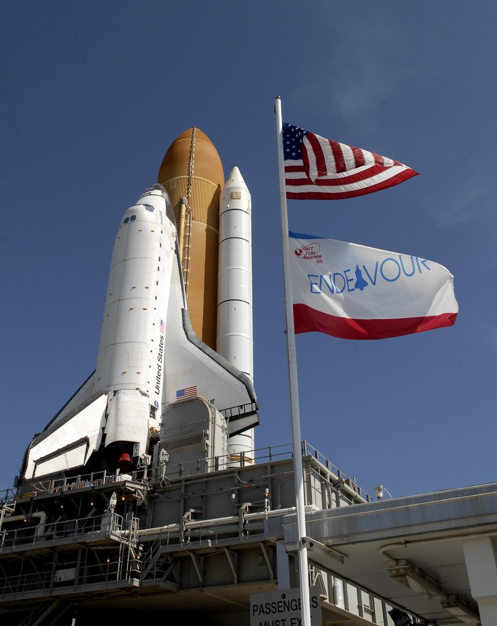 CAPE CANAVERAL, Fla. – At NASA's Kennedy Space Center in Florida, flags swing in the breeze as space shuttle Endeavour approaches Launch Pad 39A.   First motion of the 3.4-mile rollaround from Launch Pad 39B was at 3:16 a.m. EDT.  Endeavour was on standby on Pad 39B to be used in the unlikely event that a rescue mission was necessary during space shuttle Atlantis' STS-125 mission to NASA's Hubble Space Telescope. The payload on Endeavour's next mission, STS-127, includes the Japan Aerospace Exploration Agency's Kibo Exposed Facility and the Experiment Logistics Module Exposed Section of the International Space Station. They will be installed on the Kibo laboratory already on the station. Launch of STS-127 is targeted for June 13. Photo credit: NASA/Kim Shiflett