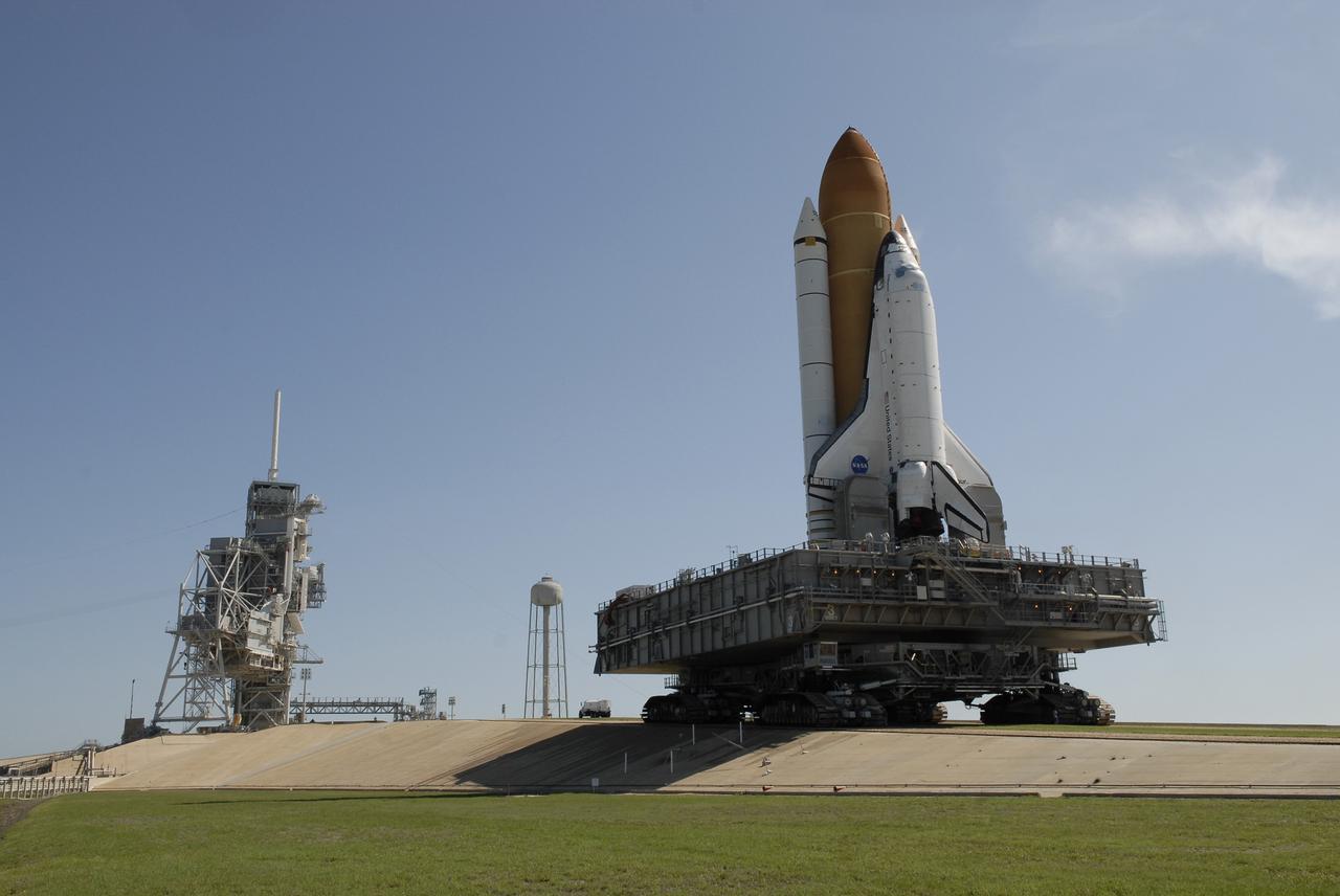 CAPE CANAVERAL, Fla. – At NASA's Kennedy Space Center in Florida, space shuttle Endeavour makes its final approach toward the fixed and rotating service structures on  Launch Pad 39A, at left.   First motion of the 3.4-mile rollaround from Launch Pad 39B was at 3:16 a.m. EDT.  Endeavour was on standby on Pad 39B to be used in the unlikely event that a rescue mission was necessary during space shuttle Atlantis' STS-125 mission to NASA's Hubble Space Telescope. The payload on Endeavour's next mission, STS-127, includes the Japan Aerospace Exploration Agency's Kibo Exposed Facility and the Experiment Logistics Module Exposed Section of the International Space Station. They will be installed on the Kibo laboratory already on the station. Launch of STS-127 is targeted for June 13. Photo credit: NASA/Kim Shiflett
