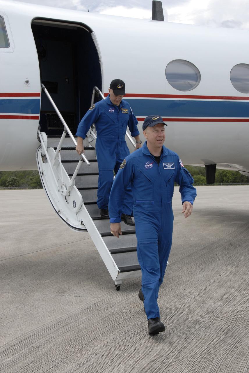 CAPE CANAVERAL, Fla. – Space shuttle Endeavour's STS-127 mission crew members disembark from the Shuttle Training Aircraft at NASA Kennedy Space Center's Shuttle Landing Facility.  Leading the way, at right, is Mission Specialist Tim Kopra, followed by Pilot Doug Hurley.  The astronauts will be taking part in Terminal Countdown Demonstration Test activities that include equipment familiarization and emergency egress training, and culminates in a simulated launch countdown aboard Endeavour.  The STS-127 mission is the final of three flights dedicated to the assembly of the Japanese Kibo laboratory complex.  Launch is targeted for June 13.  Photo credit: NASA/Kim Shiflett