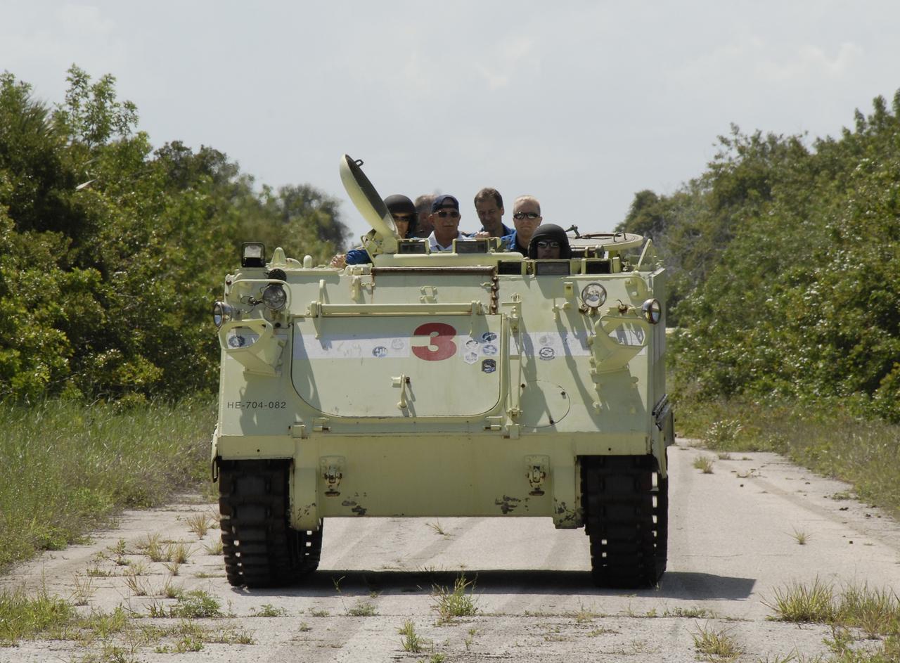CAPE CANAVERAL, Fla. – STS-127 Mission Specialist Christopher Cassidy practices driving the M-113 armored personnel carrier, which is part of the training on emergency egress procedures.  Other crew members seated behind him are Mission Specialist Julie Payette, Dave Wolf, Tom Marshburn and Pilot Doug Hurley, who will take their turns at driving the M-113.  An M-113 will be available to transport the crew to safety in the event of a contingency on the pad before their launch. The crew is at NASA's Kennedy Space Center for a launch dress rehearsal called the terminal countdown demonstration test, or TCDT, which includes the emergency egress training and equipment familiarization.  The STS-127 mission is the final of three flights dedicated to the assembly of the Japanese Kibo laboratory complex.  Endeavour's launch is targeted for June 13.  Photo credit: NASA/Kim Shiflett