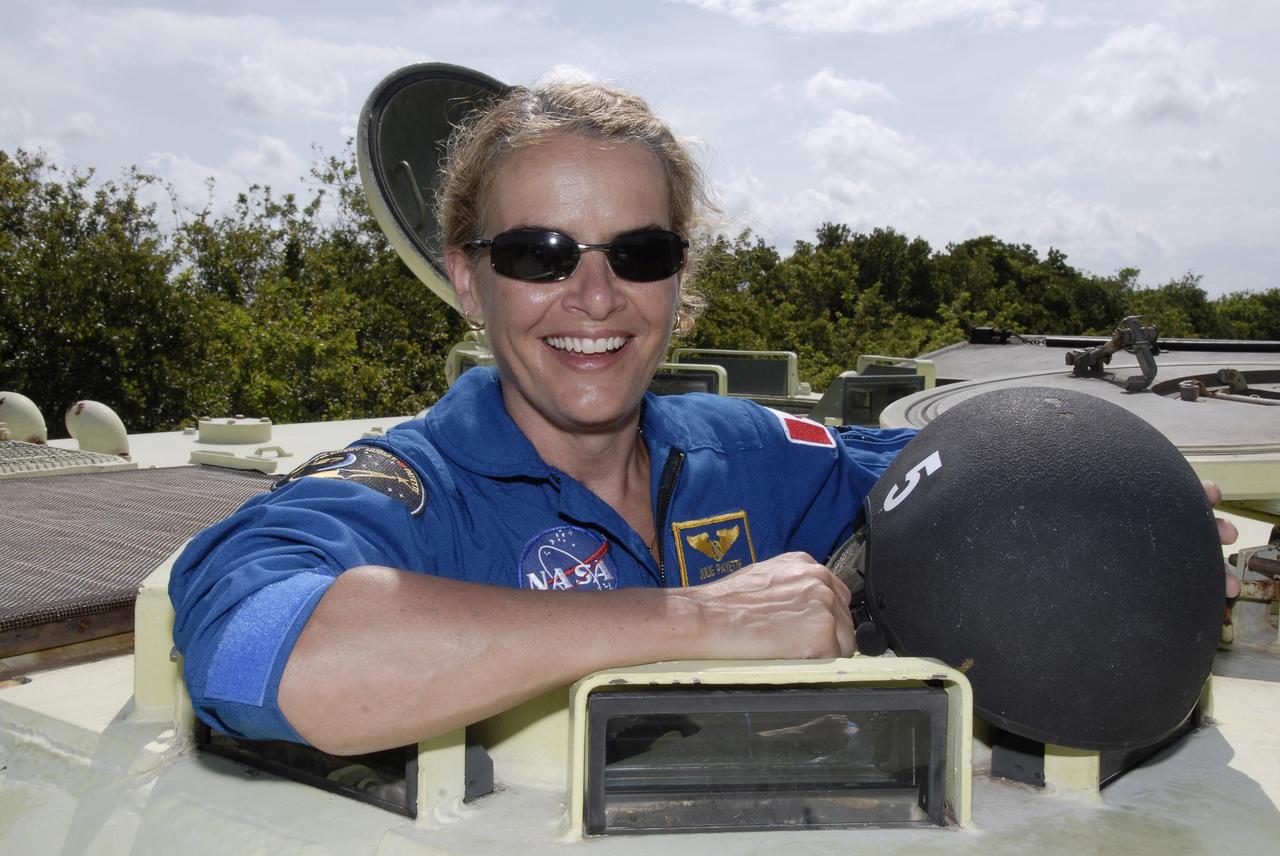 CAPE CANAVERAL, Fla. – STS-127 Mission Specialist Julie Payette smiles after her success in driving the M-113 armored personnel carrier, which is part of the training on emergency egress procedures.  Payette represents the Canadian Space Agency. The crew members of space shuttle Endeavour's STS-127 mission are taking turns driving the M-113.  An M-113 will be available to transport the crew to safety in the event of a contingency on the pad before their launch. The crew is at NASA's Kennedy Space Center for a launch dress rehearsal called the terminal countdown demonstration test, or TCDT, which includes the emergency egress training and equipment familiarization.  The STS-127 mission is the final of three flights dedicated to the assembly of the Japanese Kibo laboratory complex.  Endeavour's launch is targeted for June 13.  Photo credit: NASA/Kim Shiflett