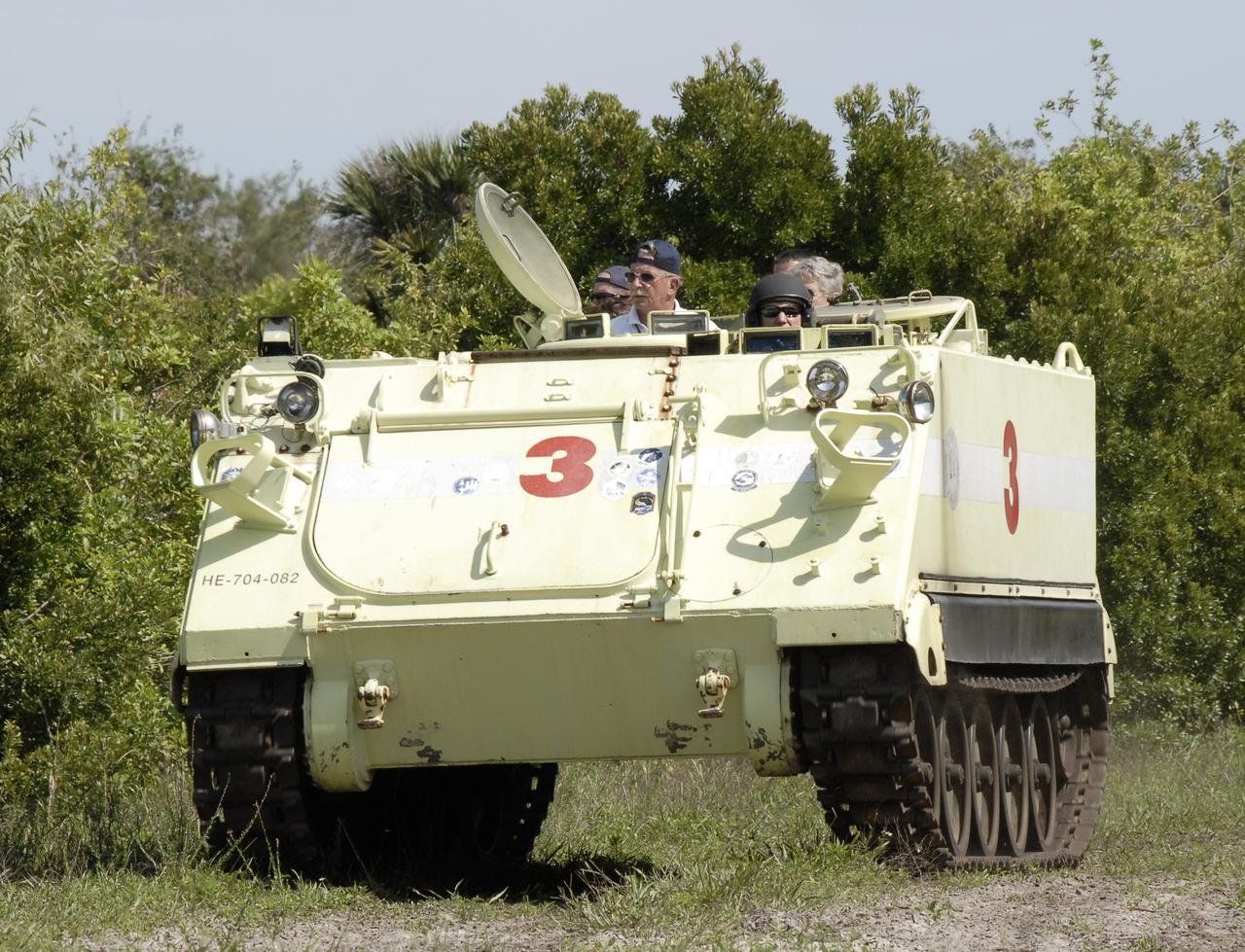 CAPE CANAVERAL, Fla. – STS-127 Mission Specialist Tim Kopra practices driving the M-113 armored personnel carrier, which is part of the training on emergency egress procedures.  Other crew members are seated behind him and will take their turns at driving the M-113.  An M-113 will be available to transport the crew to safety in the event of a contingency on the pad before their launch. The crew is at NASA's Kennedy Space Center for a launch dress rehearsal called the terminal countdown demonstration test, or TCDT, which includes the emergency egress training and equipment familiarization.  The STS-127 mission is the final of three flights dedicated to the assembly of the Japanese Kibo laboratory complex.  Endeavour's launch is targeted for June 13.  Photo credit: NASA/Kim Shiflett