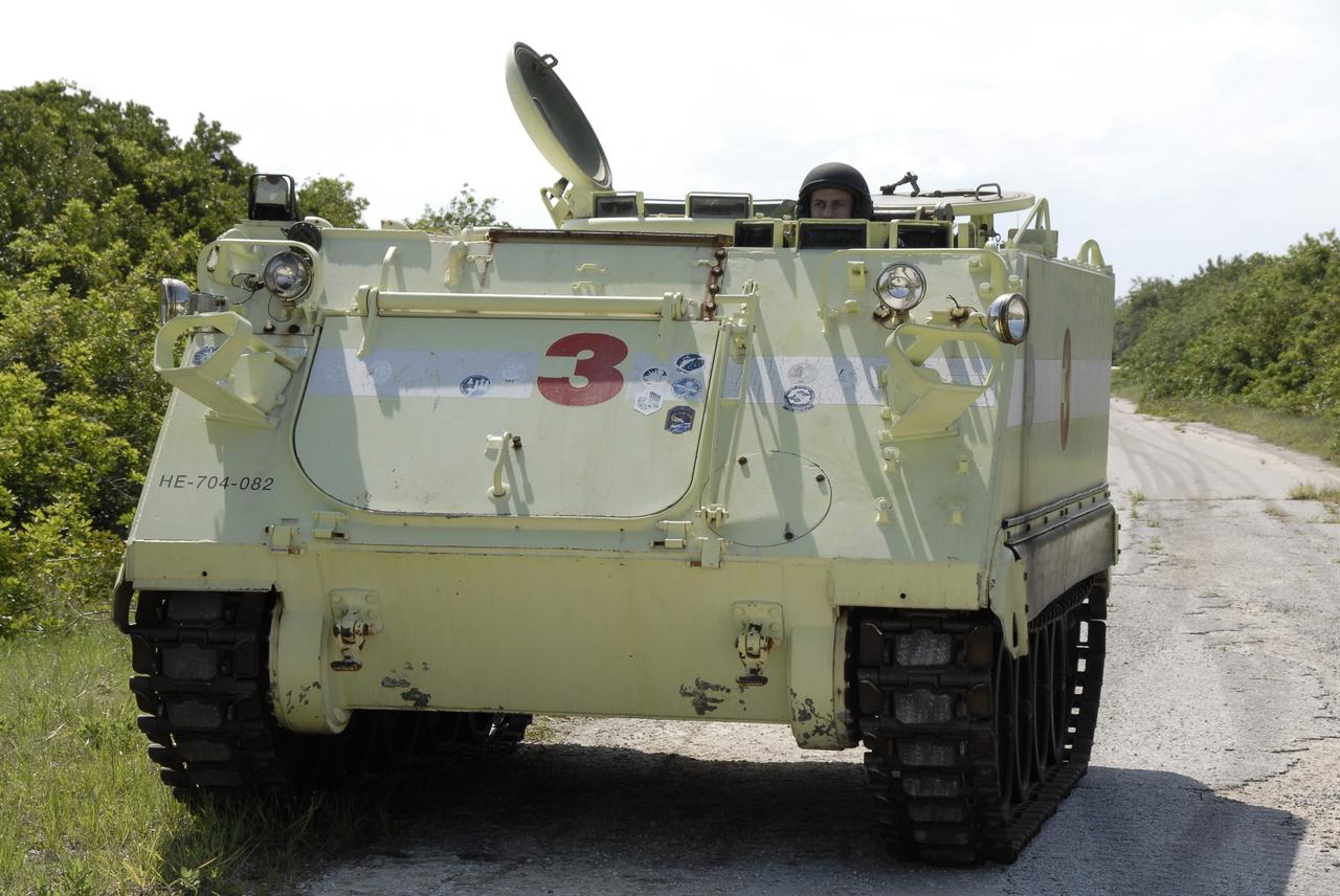 CAPE CANAVERAL, Fla. – STS-127 Mission Specialist Tom Marshburn takes his turn driving the M-113 armored personnel carrier, which is part of the training on emergency egress procedures.  The crew members of space shuttle Endeavour's STS-127 mission are taking turns driving the M-113.  An M-113 will be available to transport the crew to safety in the event of a contingency on the pad before their launch. The crew is at NASA's Kennedy Space Center for a launch dress rehearsal called the terminal countdown demonstration test, or TCDT, which includes the emergency egress training and equipment familiarization.  The STS-127 mission is the final of three flights dedicated to the assembly of the Japanese Kibo laboratory complex.  Endeavour's launch is targeted for June 13.  Photo credit: NASA/Kim Shiflett