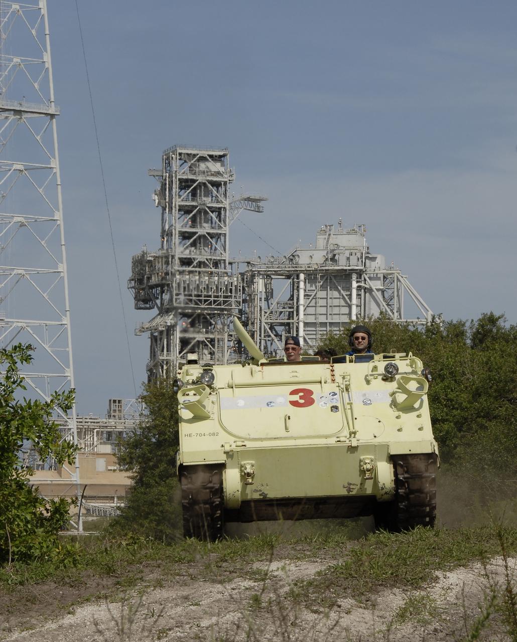CAPE CANAVERAL, Fla. – STS-127 Commander Mark Polansky takes his turn driving the M-113 armored personnel carrier, which is part of the training on emergency egress procedures.  The crew members of space shuttle Endeavour's STS-127 mission are taking turns driving the M-113. An M-113 will be available to transport the crew to safety in the event of a contingency on the pad before their launch. The crew is at NASA's Kennedy Space Center for a launch dress rehearsal called the terminal countdown demonstration test, or TCDT, which includes the emergency egress training and equipment familiarization.  The STS-127 mission is the final of three flights dedicated to the assembly of the Japanese Kibo laboratory complex.  Endeavour's launch is targeted for June 13.  Photo credit: NASA/Kim Shiflett