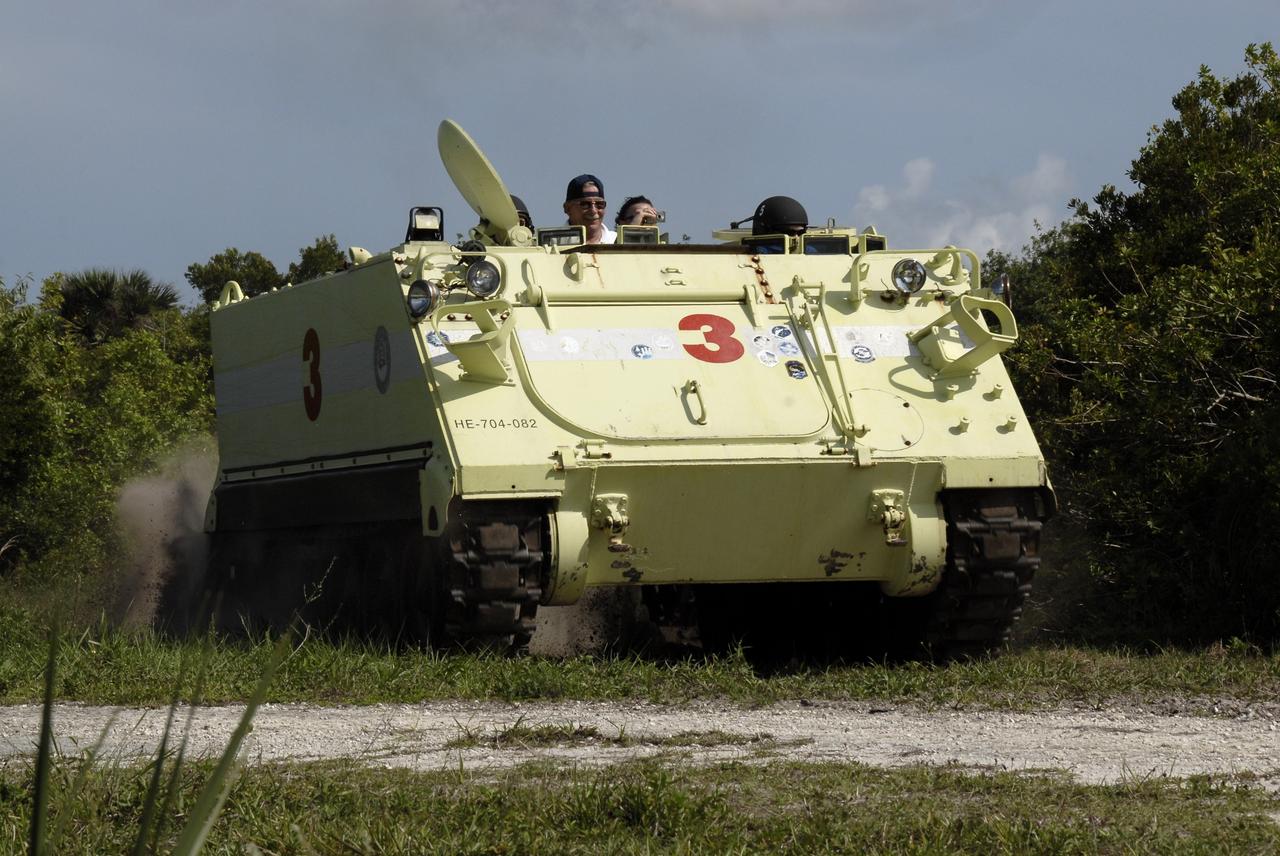 CAPE CANAVERAL, Fla. – STS-127 Pilot Doug Hurley drives the M-113 armored personnel carrier, which is part of the training on emergency egress procedures.  The crew members of space shuttle Endeavour's STS-127 mission are taking turns driving the M-113, which will be available to transport the crew to safety in the event of a contingency on the pad before their launch. The crew is at NASA's Kennedy Space Center for a launch dress rehearsal called the terminal countdown demonstration test, or TCDT, which includes the emergency egress training and equipment familiarization.  The STS-127 mission is the final of three flights dedicated to the assembly of the Japanese Kibo laboratory complex.  Endeavour's launch is targeted for June 13.  Photo credit: NASA/Kim Shiflett