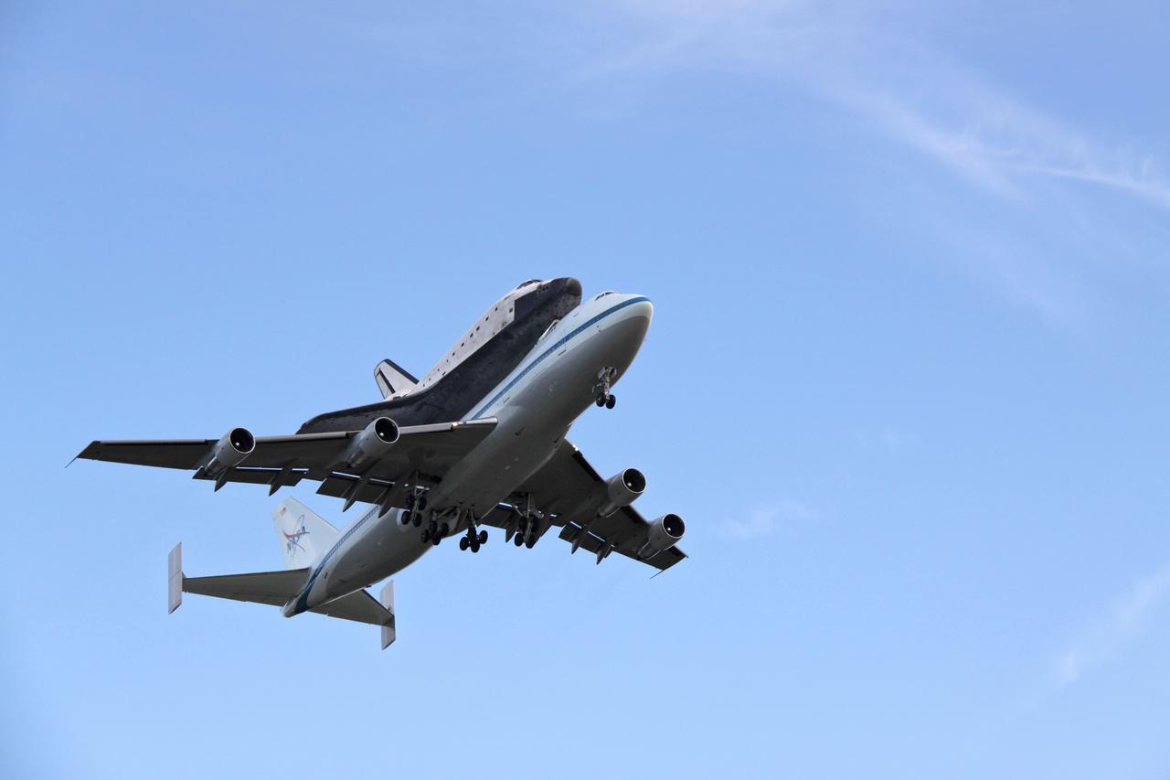 CAPE CANAVERAL, Fla. – After a two-day trip from California, the Shuttle Carrier Aircraft, or SCA, and its piggyback passenger space shuttle Atlantis approach NASA Kennedy Space Center's Shuttle Landing Facility runway. The SCA is a modified Boeing 747 jetliner. Atlantis returned from California atop the SCA after its May 24 landing at Edwards Air Force Base, concluding mission STS-125. The ferry flight from Edwards Air Force Base began June 1. Touchdown at Kennedy was at 6:53 p.m. EDT. Photo credit: NASA/Jack Pfaller