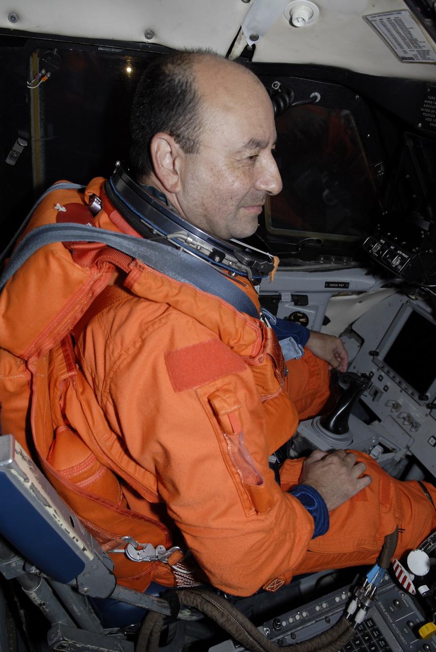 CAPE CANAVERAL, Fla. –  On the Shuttle Landing Facility at NASA's Kennedy Space Center in Florida, STS-127 Commander Mark Polansky is wearing his complete launch-and-entry suit in the cockpit of the Shuttle Training Aircraft. He is preparing to practice shuttle landings in preparation for launch of space shuttle Endeavour on the STS-127 mission, targeted for June 13.   The STA is a Grumman American Aviation-built Gulf Stream II jet that was modified to simulate a shuttle’s cockpit, motion and visual cues, and handling qualities. The crew is at Kennedy for a launch dress rehearsal called the terminal countdown demonstration test, or TCDT, which includes emergency egress training and equipment familiarization. The STS-127 mission is the final of three flights dedicated to the assembly of the Japanese Kibo laboratory complex on the International Space Station. It is the 127th shuttle flight  and the 29th in the assembly of the space station.  Photo credit: NASA/Kim Shiflett