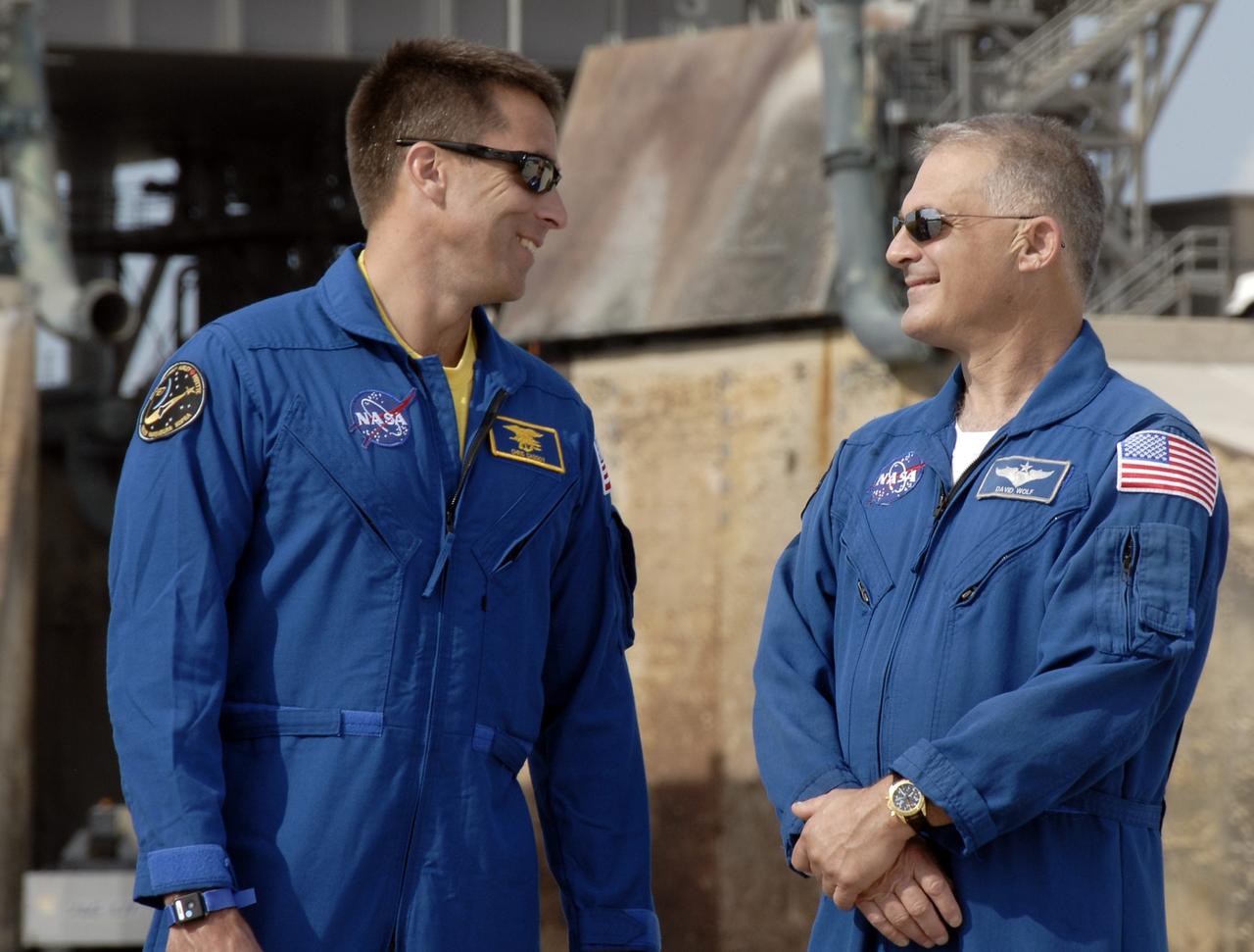CAPE CANAVERAL, Fla. –  During a question-and-answer session with the media at NASA Kennedy Space Center's Launch Pad 39A, STS-127 Mission Specialists Christopher Cassidy (left) and Dave Wolf banter about their shared experiences. The crew is at Kennedy for a launch dress rehearsal called the terminal countdown demonstration test, or TCDT, which includes emergency egress training and equipment familiarization.  Space shuttle Endeavour's STS-127 mission is the final of three flights dedicated to the assembly of the Japanese Kibo laboratory complex on the International Space Station.  Endeavour's launch is targeted for June 13.    Photo credit: NASA/Kim Shiflett