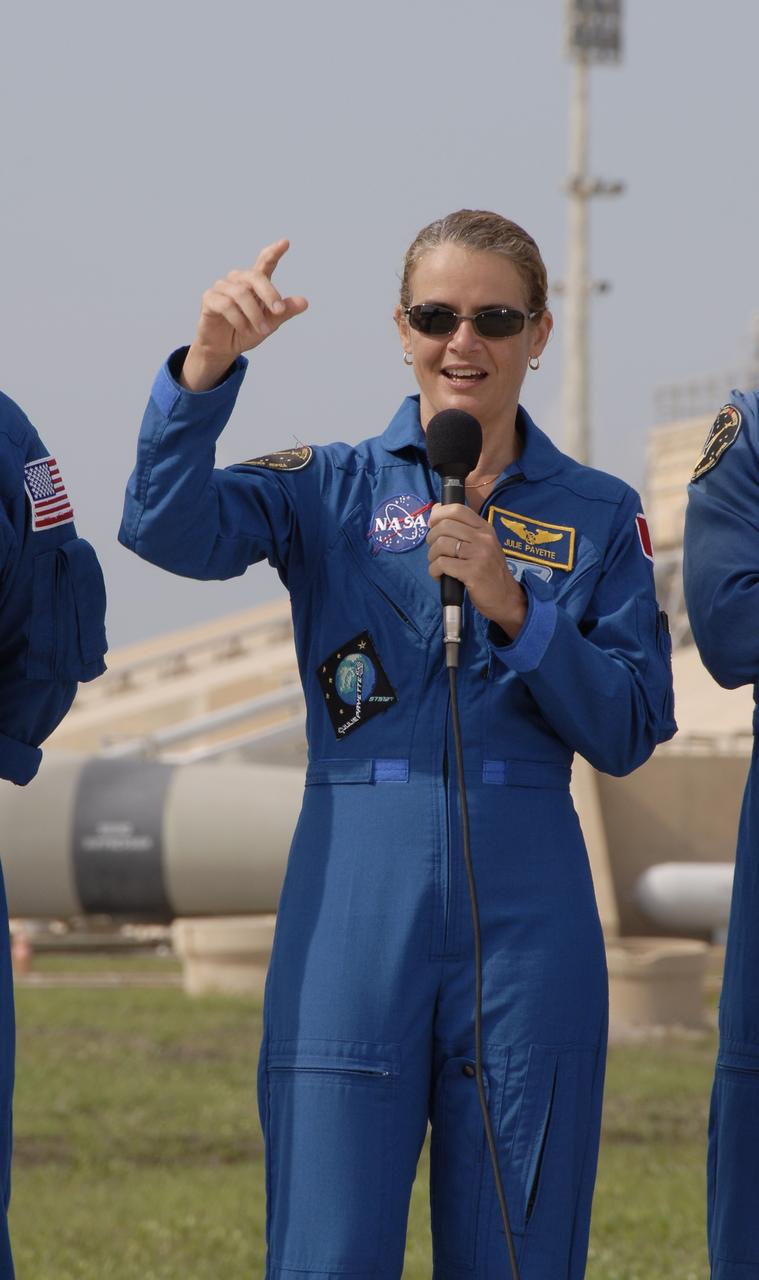 CAPE CANAVERAL, Fla. –  STS-127 Mission Specialist Julie Payette answers a question during a session with the media at NASA Kennedy Space Center's Launch Pad 39A. Payette represents the Canadian Space Agency.  The crew is at Kennedy for a launch dress rehearsal called the terminal countdown demonstration test, or TCDT, which includes emergency egress training and equipment familiarization.  Space shuttle Endeavour's STS-127 mission is the final of three flights dedicated to the assembly of the Japanese Kibo laboratory complex on the International Space Station.  Endeavour's launch is targeted for June 13.    Photo credit: NASA/Kim Shiflett
