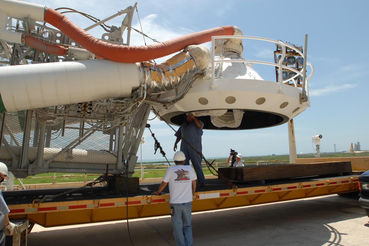 CAPE CANAVERAL, Fla. – At NASA's Kennedy Space Center in Florida, workers check the "beanie cap" and the gaseous oxygen vent arm removed from Launch Pad 39B's fixed service structure. A portion of the service structure is being removed for the pad's conversion as launch site for the Constellation Program's Ares I-X. The launch of the Ares I-X flight test is targeted for August 2009. Photo credit: NASA/Jim Grossmann