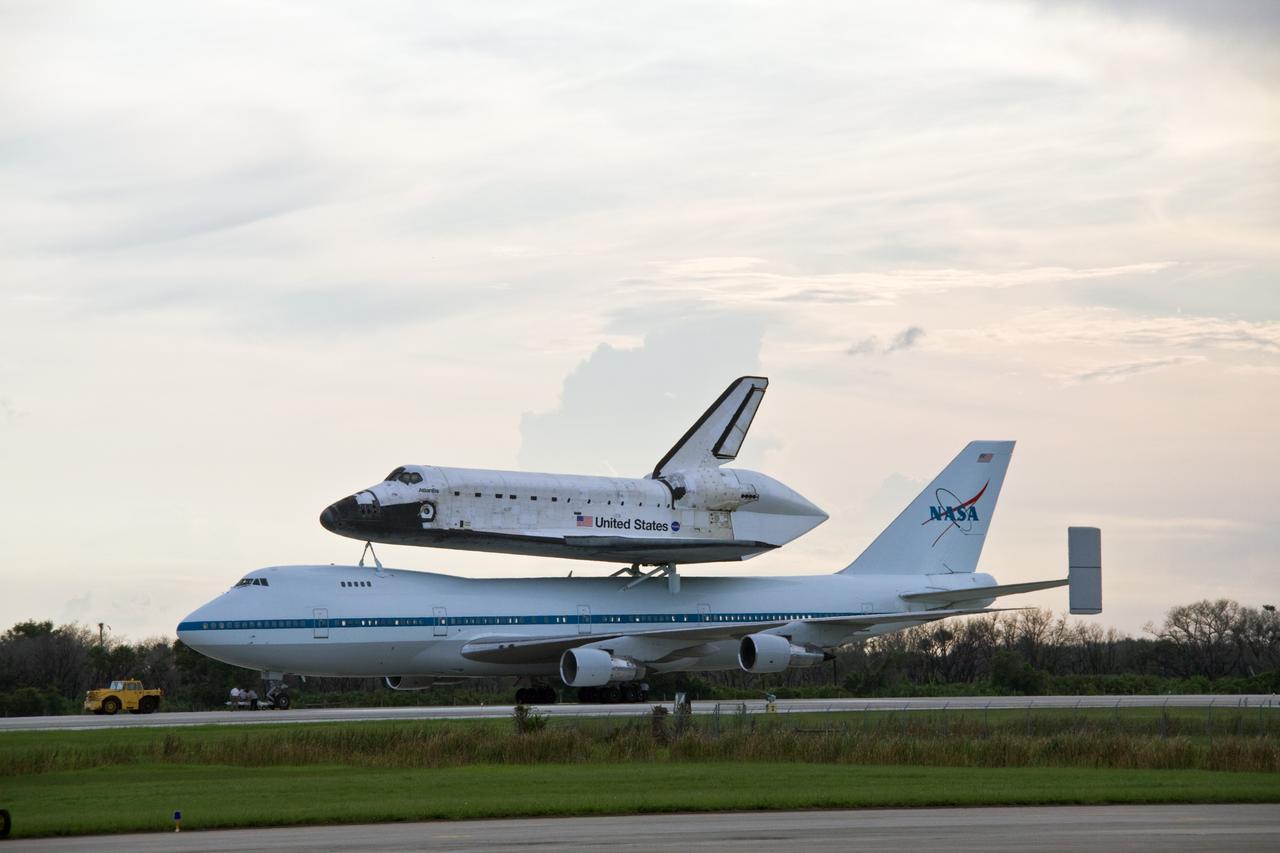 CAPE CANAVERAL, Fla. –  After a two-day trip from California, space shuttle Atlantis, atop a Shuttle Carrier Aircraft, or SCA, is towed from the runway at NASA's Kennedy Space Center in Florida. The SCA is a modified Boeing 747 jetliner.  Atlantis returned from California atop the SCA after its May 24 landing at Edwards Air Force Base, concluding mission STS-125. The ferry flight from Edwards Air Force Base began June 1. Atlantis' next assignment is the STS-129 mission, targeted to launch in November 2009.  Photo credit: NASA/Jack Pfaller