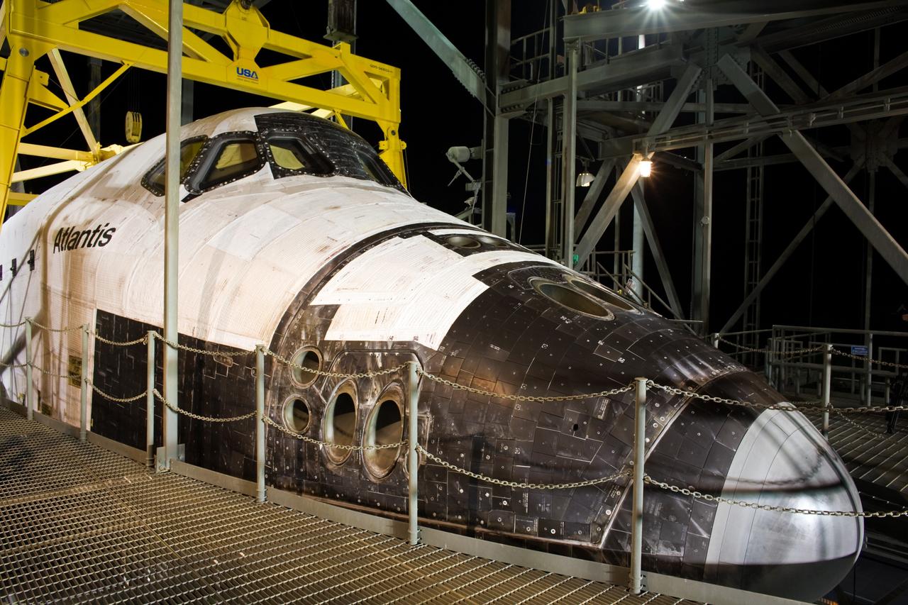 CAPE CANAVERAL, Fla. – Just before sunrise, preparations are underway to separate space shuttle Atlantis from the Shuttle Carrier Aircraft, or SCA, underneath via the mate/demate device. The hoist is attached to Atlantis to lower the shuttle to the ground. Atlantis returned from California atop the SCA after its May 24 landing at Edwards Air Force Base, concluding mission STS-125. The ferry flight from Edwards Air Force Base began June 1. Atlantis' next assignment is the STS-129 mission, targeted to launch in November 2009. Photo credit: NASA/Dimitri Gerondidakis