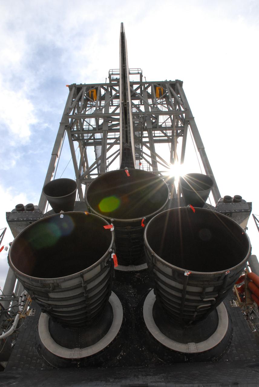 CAPE CANAVERAL, Fla. – The sun casts diamond-bright light over space shuttle Atlantis under the mate/demate device at Edwards Air Force Base in California. Atlantis is being fitted with a sling to lift it for attachment to the Shuttle Carrier Aircraft, or SCA, a modified Boeing 747. Atlantis landed at Edwards on May 24, which concluded mission STS-125, after two landing opportunities at Kennedy were waved off due to weather concerns. Atlantis is being returned to Florida on a ferry flight on the SCA. Atlantis' next assignment is the STS-129 mission, targeted to launch in November 2009. Photo credit: NASA/Ben Smegelsky