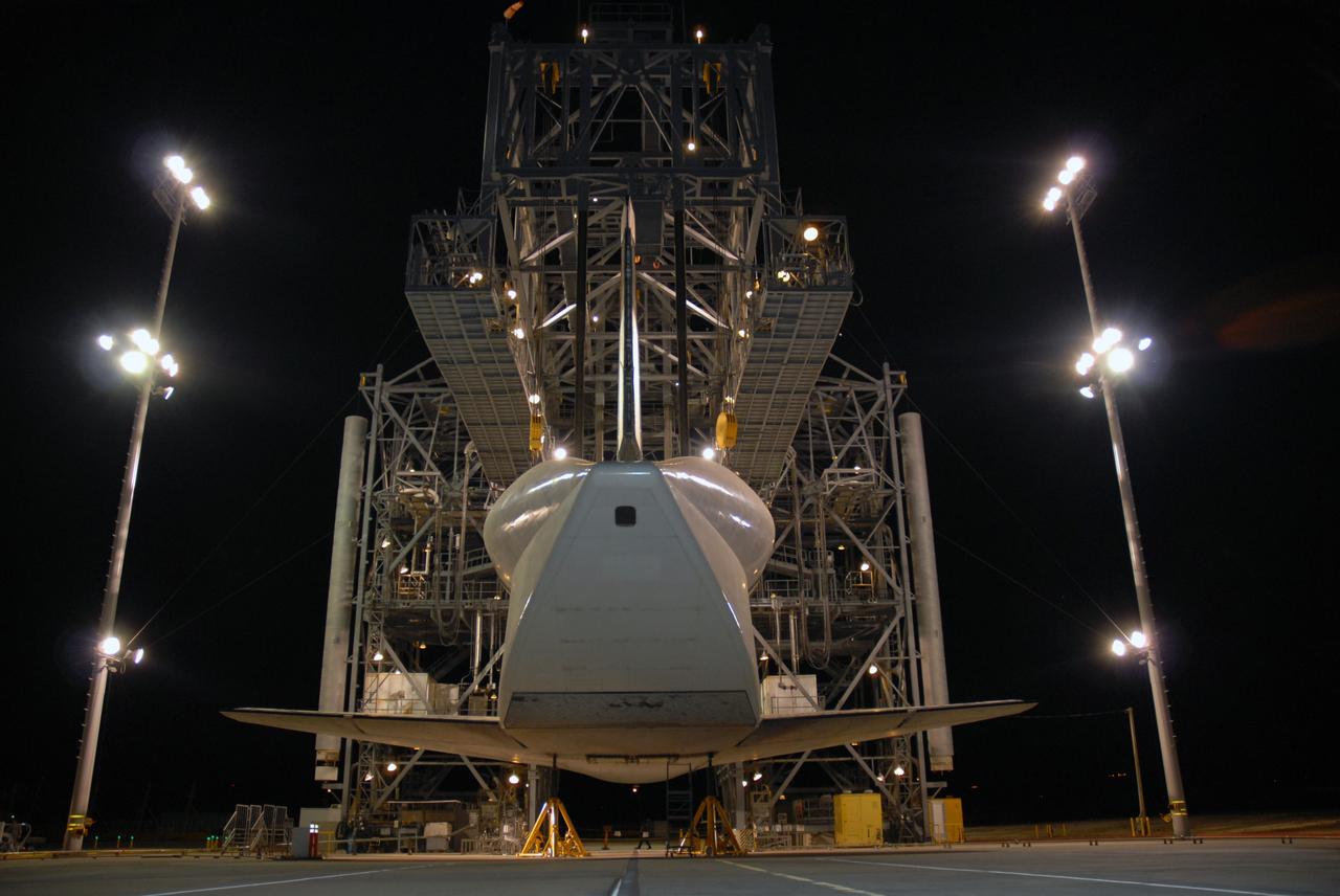 CAPE CANAVERAL, Fla. – Space shuttle Atlantis glows from surrounding lights in the mate/demate device at Edwards Air Force Base in California. Atlantis landed at Edwards on May 24, which concluded mission STS-125, after two landing opportunities at Kennedy were waved off due to weather concerns. Atlantis is being returned to Florida on a ferry flight on the SCA. Atlantis' next assignment is the STS-129 mission, targeted to launch in November 2009. Photo credit: NASA/Ben Smegelsky