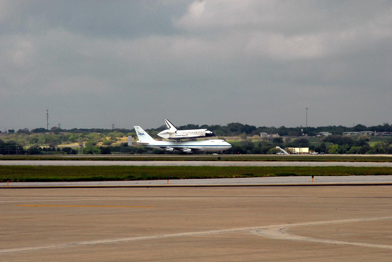 CAPE CANAVERAL, Fla. – Hitching a ride on the Shuttle Carrier Aircraft, or SCA, a modified Boeing 747, space shuttle Atlantis has arrived in Lackland Air Force Base's Kelly Field Annex in Texas for a fuel stop on its journey back to Florida.  Atlantis' next assignment is the STS-129 mission, targeted to launch in November 2009.   Photo credit: NASA/Ben Smegelsky