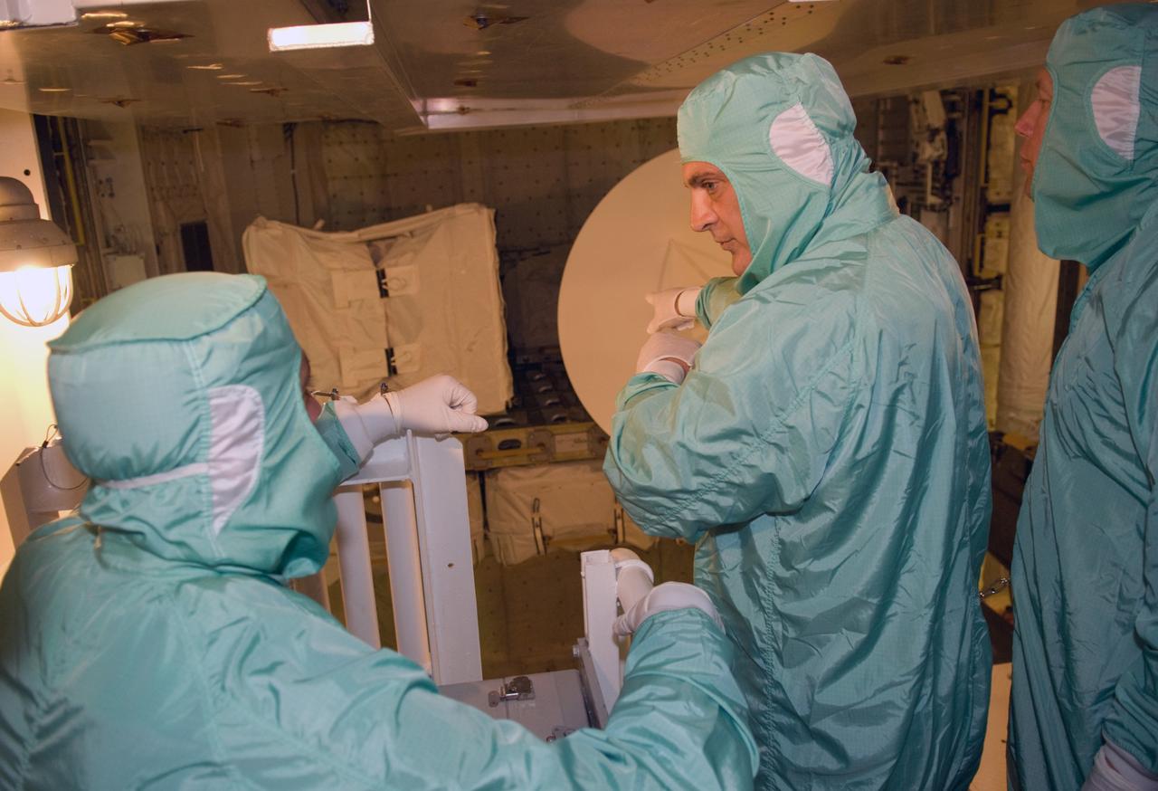 CAPE CANAVERAL, Fla. – On Launch Pad 39A at NASA's Kennedy Space Center in Florida, STS-127 crew members get a close look at the payload in space shuttle Endeavour's payload bay. At right is Mission Specialist Dave Wolf. The payload includes the Japanese Experiment Module's Exposed Facility, or JEM-EF, and the Experiment Logistics Module-Exposed Section, or ELM-ES. The astronauts are at Kennedy to prepare for launch through Terminal Countdown Demonstration Test activities. The TCDT includes equipment familiarization and a simulated launch countdown. Endeavour's STS-127 mission is the final of three flights dedicated to the assembly of the Japanese Kibo laboratory complex on the International Space Station. Endeavour's launch is targeted for June 13. Photo credit: NASA/Kim Shiflett