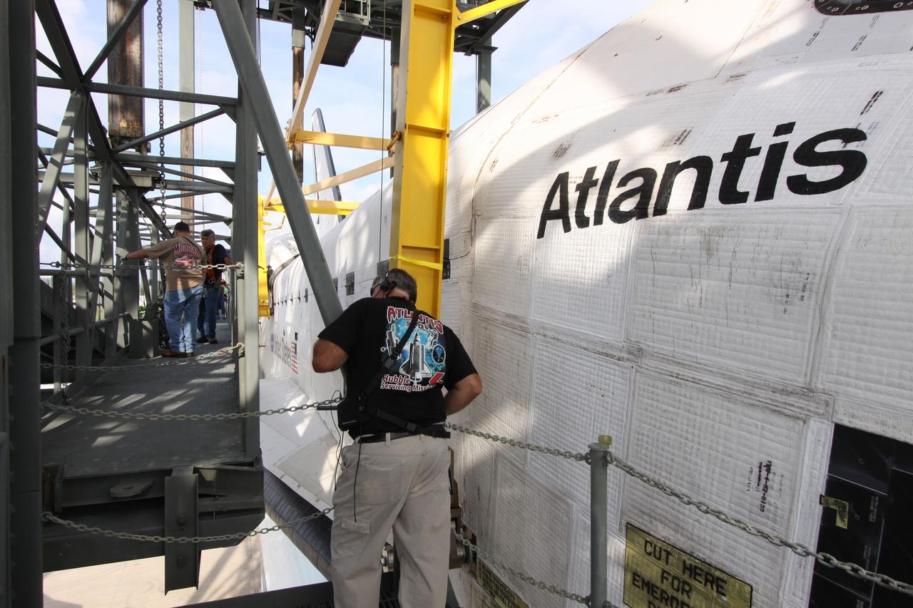 CAPE CANAVERAL, Fla. –  Preparations are under way to separate space shuttle Atlantis from the Shuttle Carrier Aircraft, or SCA, underneath via the mate/demate device on the Shuttle Landing Facility at NASA's Kennedy Space Center in Florida.  A hoist is attached to Atlantis to lower the shuttle to the ground.  Atlantis returned from California atop the SCA, a modified Boeing 747, after its May 24 landing at Edwards Air Force Base, concluding mission STS-125. The ferry flight from Edwards Air Force Base began June 1. Atlantis' next assignment is the STS-129 mission, targeted to launch in November 2009.  Photo credit: NASA/Jack Pfaller