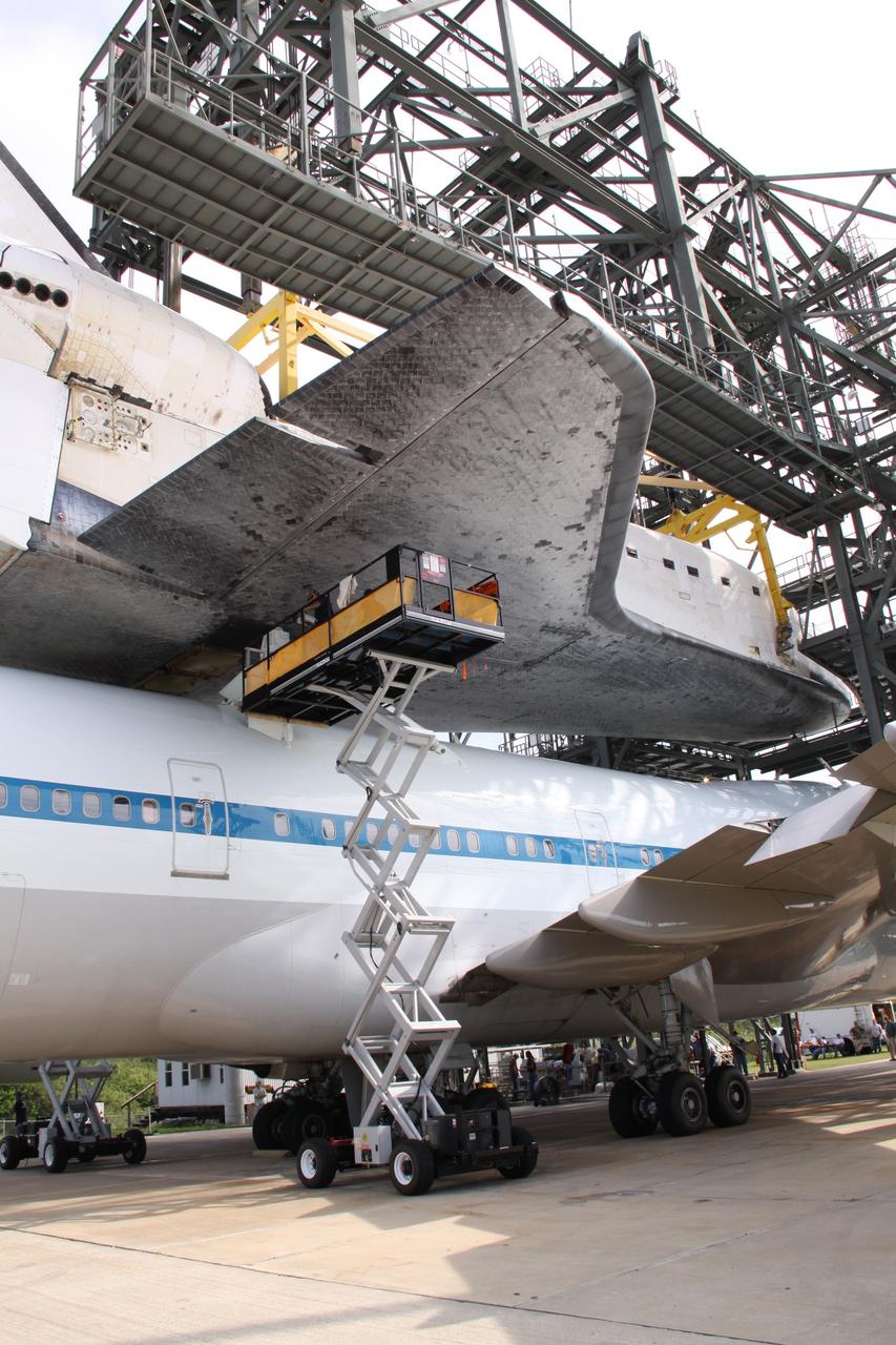 CAPE CANAVERAL, Fla. – Work is under way to separate space shuttle Atlantis from the Shuttle Carrier Aircraft, or SCA, underneath via the mate/demate device on the Shuttle Landing Facility at NASA's Kennedy Space Center in Florida. A hoist is attached to Atlantis to suspend the shuttle and then lower it to the ground. Atlantis returned from California atop the SCA, a modified Boeing 747, after its May 24 landing at Edwards Air Force Base, concluding mission STS-125. The ferry flight from Edwards Air Force Base began June 1. Atlantis' next assignment is the STS-129 mission, targeted to launch in November 2009. Photo credit: NASA/Jack Pfaller