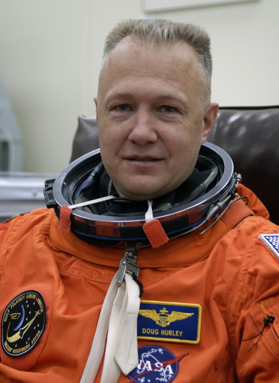 CAPE CANAVERAL, Fla. –  In the Operations and Checkout Building at NASA's Kennedy Space Center in Florida, STS-127 Pilot Doug Hurley puts on his launch-and-entry suit. He and other crew members will be heading for Launch Pad 39A for a simulated launch countdown.  The crew is at Kennedy for a launch dress rehearsal called the terminal countdown demonstration test, or TCDT, which includes emergency exit training and equipment familiarization.  Endeavour's STS-127 mission is the final of three flights dedicated to the assembly of the Japanese Kibo laboratory complex on the International Space Station.  Endeavour's launch is scheduled for June 13 at 7:17 a.m. EDT.  Photo credit: NASA/Kim Shiflett