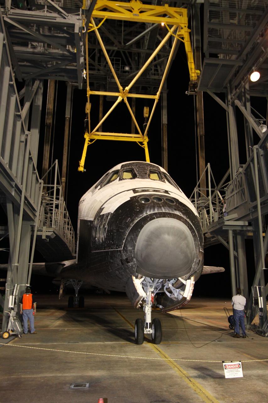 CAPE CANAVERAL, Fla. – On the Shuttle Landing Facility at NASA's Kennedy Space Center in Florida, the hoist is removed from space shuttle Atlantis before the shuttle is towed to Orbiter Processing Facility 1. After its May 24 landing at Edwards Air Force Base in California, which concluded its STS-125 mission, the modified Boeing 747 SCA carried the shuttle on a two-day ferry flight from Edwards to Kennedy beginning June 1. Atlantis' next assignment is the STS-129 mission, targeted to launch in November 2009. Photo credit: NASA/Jack Pfaller