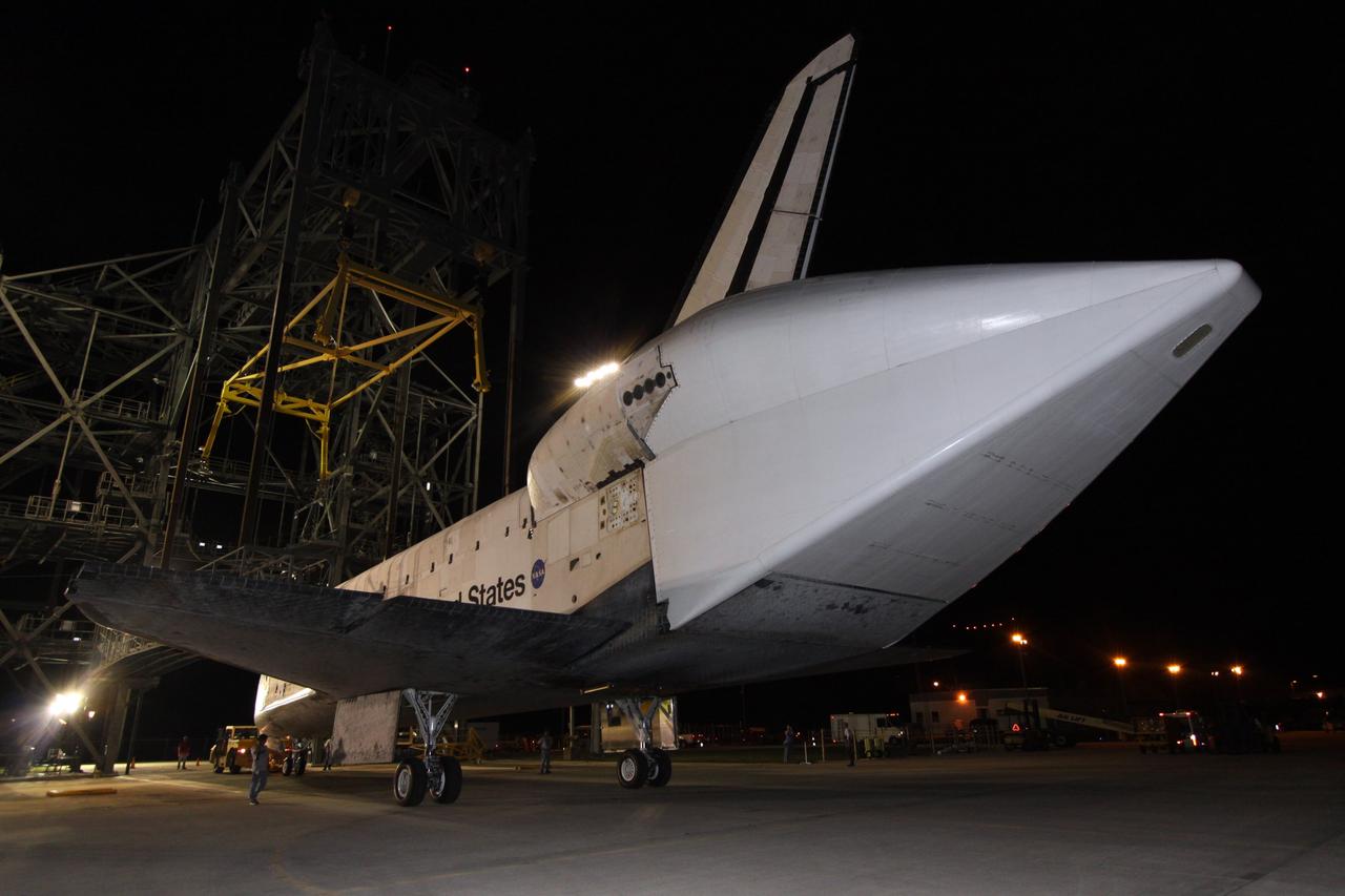 CAPE CANAVERAL, Fla. – On the Shuttle Landing Facility at NASA's Kennedy Space Center in Florida, space shuttle Atlantis is moved away from the mate/demate device where it was separated from the Shuttle Carrier Aircraft, or SCA. Atlantis will be towed to Orbiter Processing Facility 1. Covering the rear of Atlantis is a tail cone, which protects the aft engine area and provides a more efficient aeronautical dimension during its piggyback flight. After its May 24 landing at Edwards Air Force Base in California, which concluded its STS-125 mission, the modified Boeing 747 SCA carried the shuttle on a two-day ferry flight from Edwards to Kennedy beginning June 1. Atlantis' next assignment is the STS-129 mission, targeted to launch in November 2009. Photo credit: NASA/Jack Pfaller