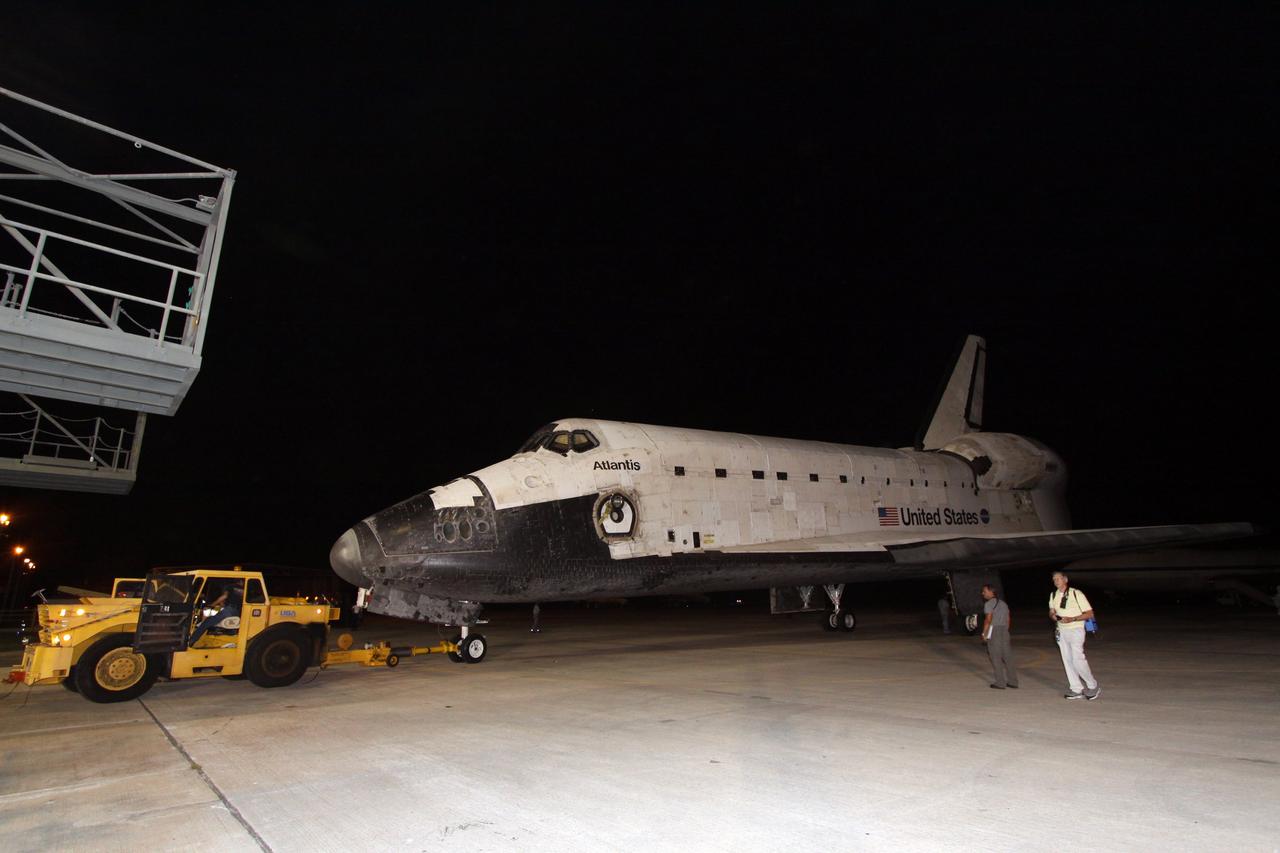 CAPE CANAVERAL, Fla. – On the Shuttle Landing Facility at NASA's Kennedy Space Center in Florida, space shuttle Atlantis is moved away from the mate/demate device where it was separated from the Shuttle Carrier Aircraft, or SCA. Atlantis will be towed to Orbiter Processing Facility 1. After its May 24 landing at Edwards Air Force Base in California, which concluded its STS-125 mission, the modified Boeing 747 SCA carried the shuttle on a two-day ferry flight from Edwards to Kennedy beginning June 1. Atlantis' next assignment is the STS-129 mission, targeted to launch in November 2009. Photo credit: NASA/Jack Pfaller