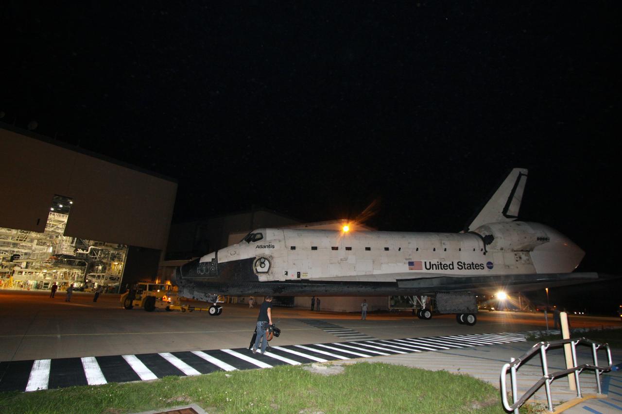 CAPE CANAVERAL, Fla. – At NASA's Kennedy Space Center in Florida, space shuttle Atlantis is towed toward Orbiter Processing Facility 1. Atlantis was demated from the Shuttle Carrier Aircraft, or SCA, via the mate/demate device at the Shuttle Landing Facility. After its May 24 landing at Edwards Air Force Base in California, which concluded its STS-125 mission, the modified Boeing 747 SCA carried the shuttle on a two-day ferry flight from Edwards to Kennedy beginning June 1. Atlantis' next assignment is the STS-129 mission, targeted to launch in November 2009. Photo credit: NASA/Jack Pfaller