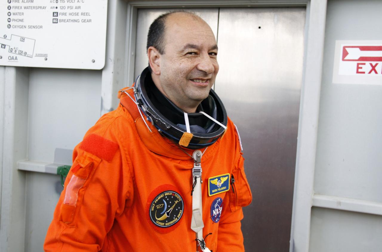CAPE CANAVERAL, Fla. – STS-127 Commander Mark Polansky approaches the White Room on the orbiter access arm of the fixed service structure on Launch Pad 39A at NASA's Kennedy Space Center in Florida. He and other crew members will use the White Room to enter space shuttle Endeavour for the simulated launch countdown. The crew is at Kennedy for a launch dress rehearsal called the terminal countdown demonstration test, or TCDT, which includes the simulation, emergency exit training and equipment familiarization. Endeavour's STS-127 mission is the final of three flights dedicated to the assembly of the Japanese Kibo laboratory complex on the International Space Station. Endeavour's launch is scheduled for June 13 at 7:17 a.m. EDT. Photo credit: NASA/Troy Cryder