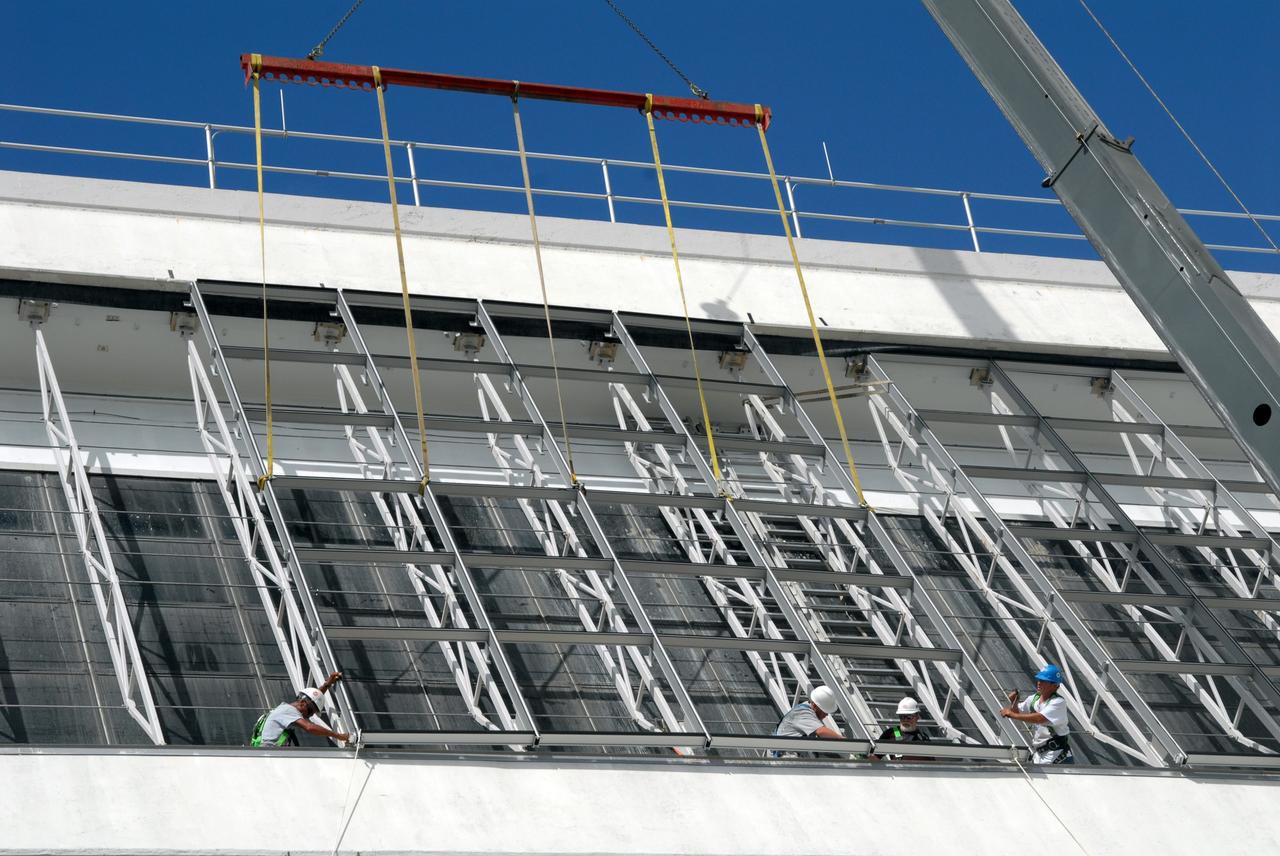 CAPE CANAVERAL, Fla. – At NASA's Kennedy Space Center in Florida, new, hurricane-rated window systems for the Launch Control Center's four Firing Rooms and the vestibule areas between Firing Rooms 1 & 2 and Firing Rooms 3 & 4 are being installed.  In order to avoid operational impacts, the new windows are being installed on the outside of the existing windows, enclosing the space formerly occupied by the louvers, and the old windows will remain in place until the new windows are completely installed and leak tested. This approach will continue to keep the firing rooms from being exposed to the elements.  Photo credit: NASA/Tim Jacobs