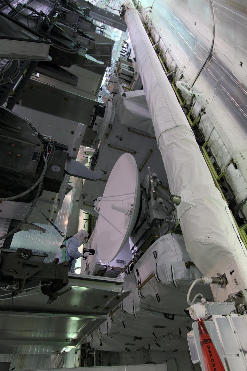 CAPE CANAVERAL, Fla. – On Launch Pad 39A at NASA's Kennedy Space Center in Florida, workers in the payload changeout room of the rotating service structure prepare to close space shuttle Endeavour's payload bay doors in preparation for the launch of the STS-127 mission. The STS-127 mission is the final of three flights dedicated to the assembly of the Japanese Kibo laboratory complex on the International Space Station. Photo credit: NASA/Jack Pfaller