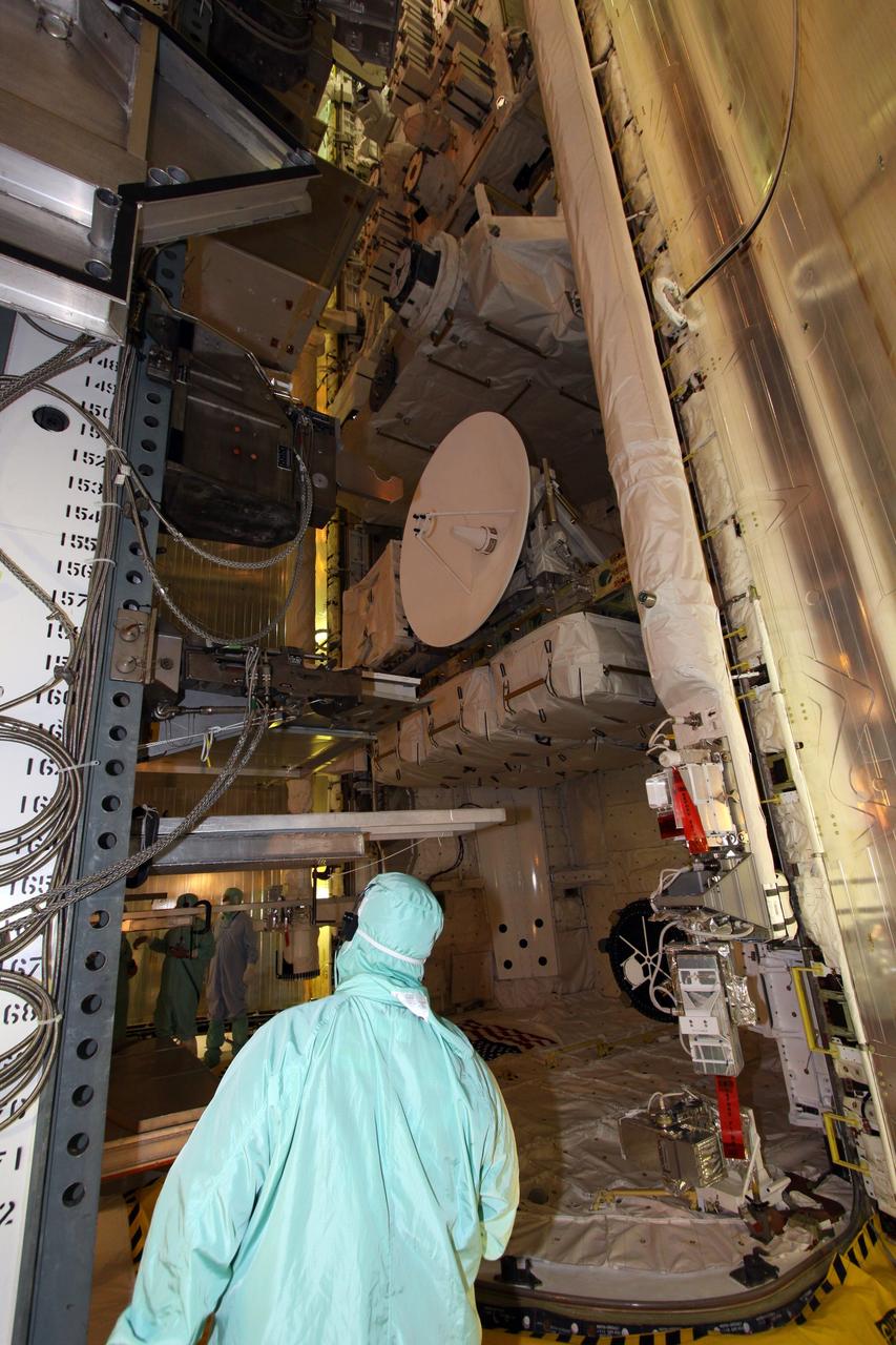 CAPE CANAVERAL, Fla. – On Launch Pad 39A at NASA's Kennedy Space Center in Florida, workers in the payload changeout room of the rotating service structure watch closely as space shuttle Endeavour's payload bay doors close in preparation for the launch of theSTS-127 mission. The STS-127 mission is the final of three flights dedicated to the assembly of the Japanese Kibo laboratory complex on the International Space Station. Photo credit: NASA/Jack Pfaller