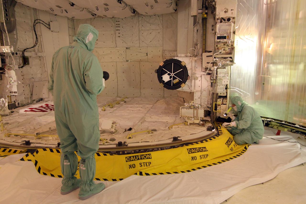 CAPE CANAVERAL, Fla. – On Launch Pad 39A at NASA's Kennedy Space Center in Florida, workers in the payload changeout room of the rotating service structure check equipment during closing of space shuttle Endeavour's payload bay doors. The STS-127 mission is the final of three flights dedicated to the assembly of the Japanese Kibo laboratory complex on the International Space Station. Photo credit: NASA/Jack Pfaller