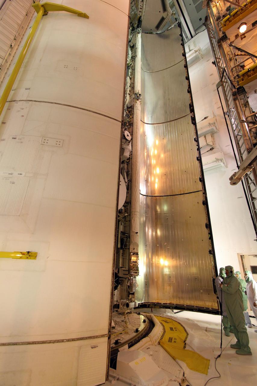 CAPE CANAVERAL, Fla. – On Launch Pad 39A at NASA's Kennedy Space Center in Florida, a worker keeps watch as the starboard payload bay door closes over space shuttle Endeavour's payload. Inside are the Integrated Cargo Carrier-Vertical Light Deploy, the Experiment Logistics Module-Exposed Section and the Japanese Experiment Module's Exposed Facility. The STS-127 mission is the final of three flights dedicated to the assembly of the Japanese Kibo laboratory complex on the International Space Station. Photo credit: NASA/Jack Pfaller