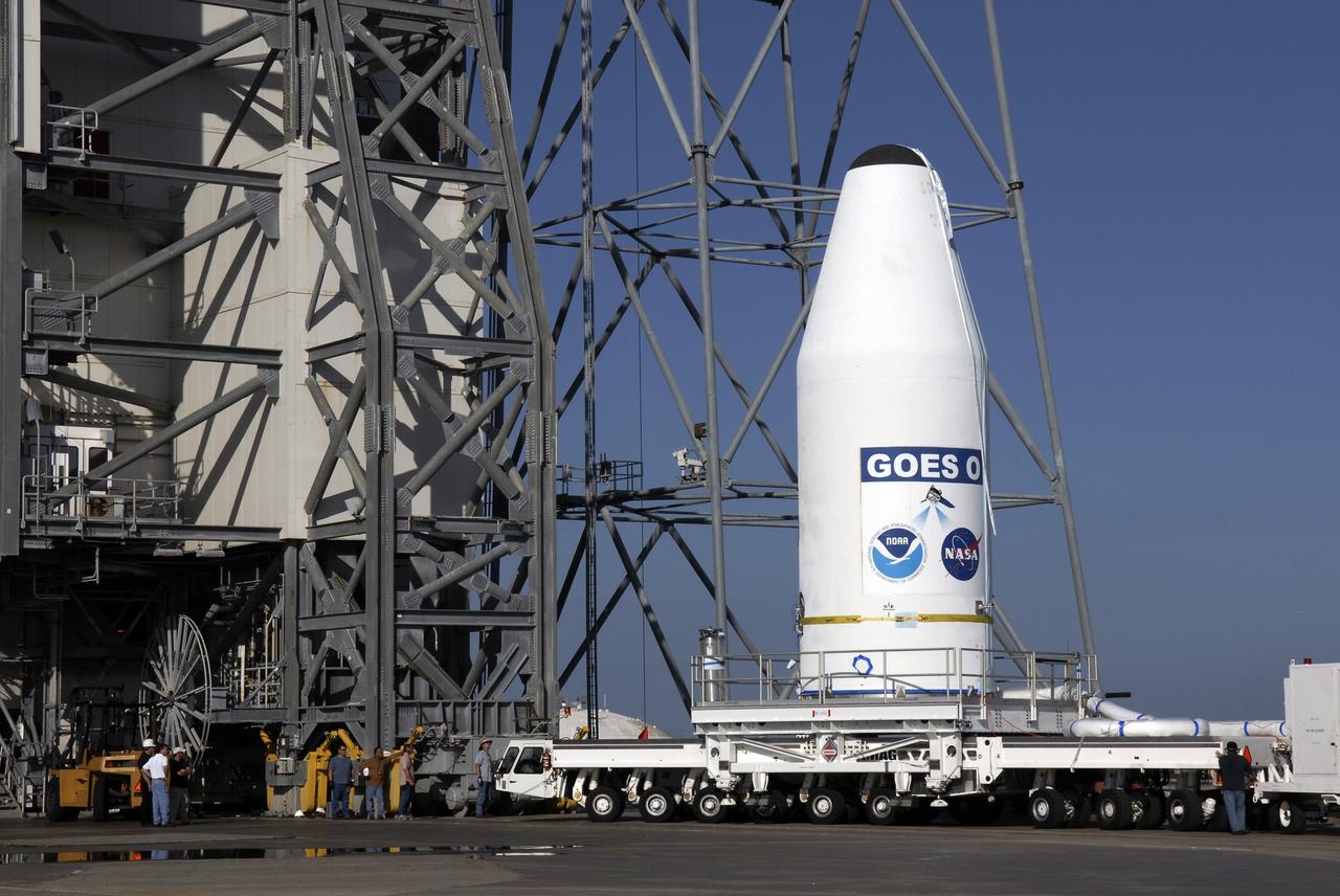 CAPE CANAVERAL, Fla. – At Cape Canaveral Air Force Station in Florida, the GOES-O satellite  arrives at the mobile service tower on Launch Complex 37.  It will be lifted into the tower and mated with the United Launch Alliance Delta IV expendable launch vehicle. The GOES-O satellite is targeted to launch no earlier than June 26. The latest Geostationary Operational Environmental Satellite, GOES-O was developed by NASA for the National Oceanic and Atmospheric Administration, or NOAA. The GOES satellites continuously provide observations of 60 percent of the Earth including the continental United States, providing weather monitoring and forecast operations as well as a continuous and reliable stream of environmental information and severe weather warnings. Once in orbit, GOES-O will be designated GOES-14, and NASA will provide on-orbit checkout and then transfer operational responsibility to NOAA.  Photo credit: NASA/Kim Shiflett