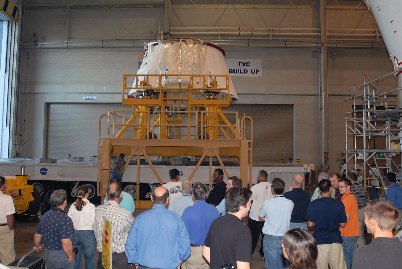 CAPE CANAVERAL, Fla. – Employees gather to witness the move of the Ares I-X aft skirt from the Assembly and Refurbishment Facility at NASA's Kennedy Space Center to the Rotation, Processing and Surge Facility. The aft skirt underwent modifications in the ARF. In the RSPF, it will be stacked with the aft motor to form the aft assembly. The complete Ares I-X will be assembled in the Vehicle Assembly Building. The launch of Ares I-X is targeted for August 2009. Photo credit: NASA/Jim Grossmann
