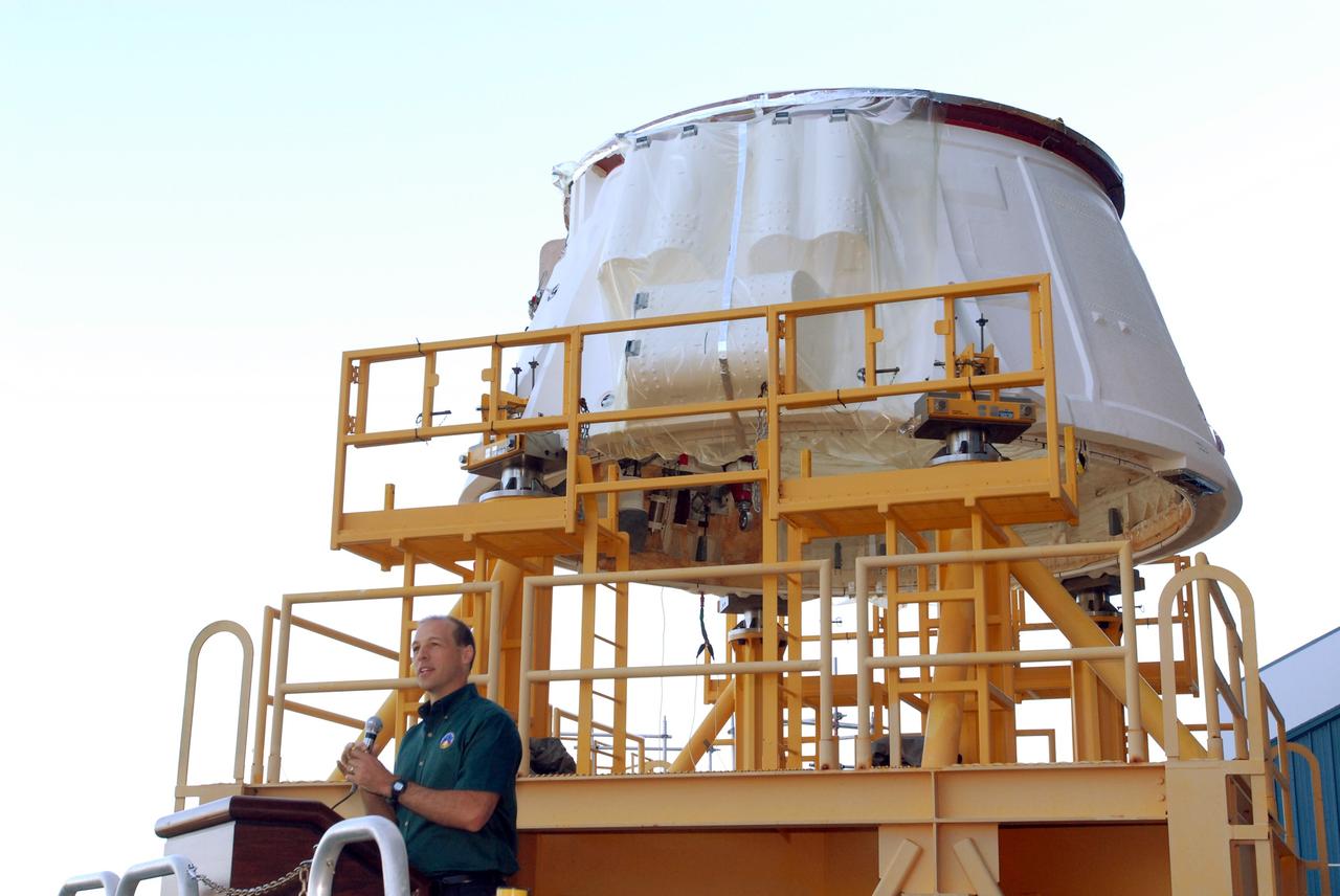 CAPE CANAVERAL, Fla. – Bob ESS, with NASA, speaks to employees before the move of the Ares I-X aft skirt from the Assembly and Refurbishment Facility at NASA's Kennedy Space Center to the Rotation, Processing and Surge Facility. The aft skirt underwent modifications in the ARF. In the RSPF, it will be stacked with the aft motor to form the aft assembly. The complete Ares I-X will be assembled in the Vehicle Assembly Building. The launch of Ares I-X is targeted for August 2009. Photo credit: NASA/Jim Grossmann