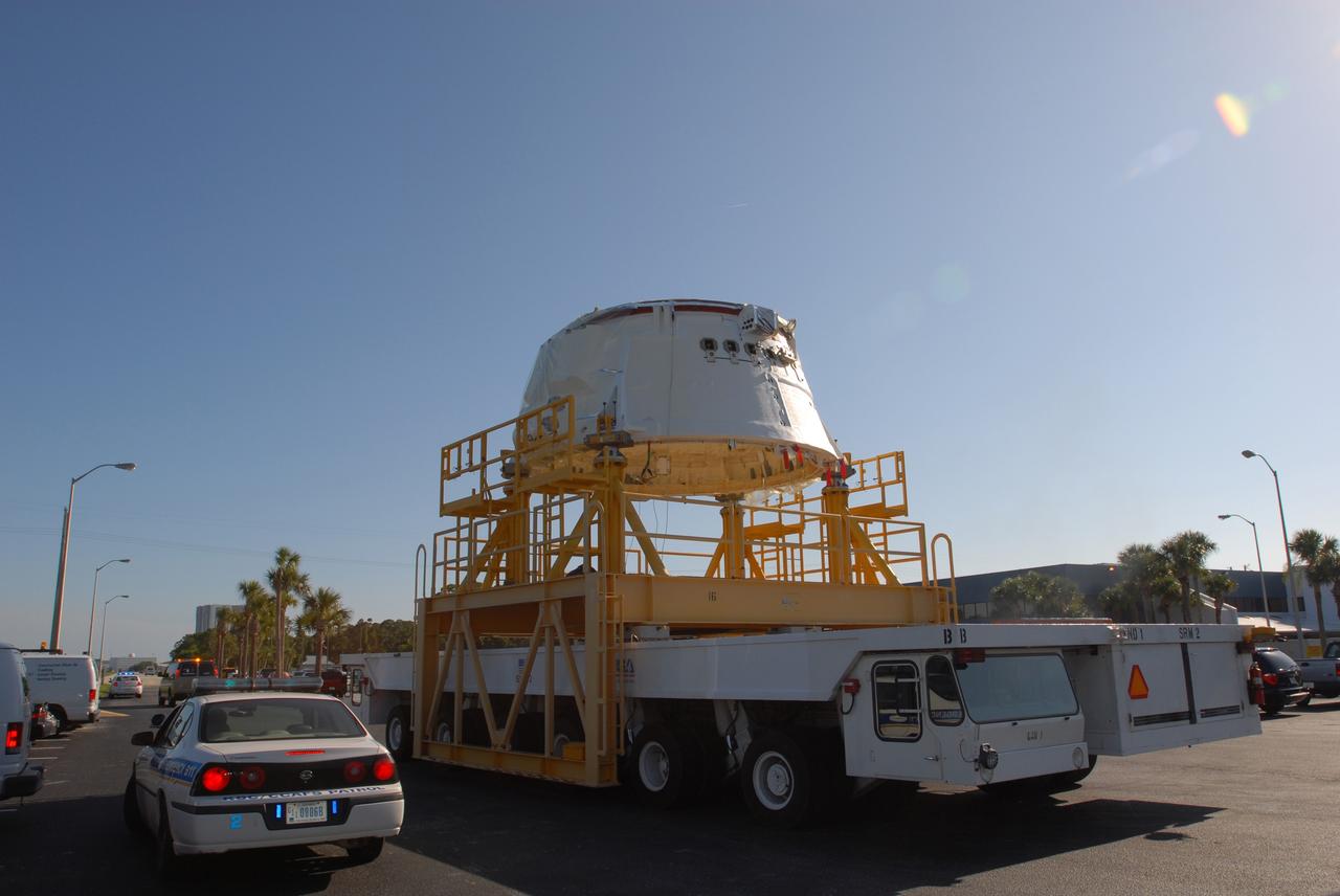 CAPE CANAVERAL, Fla. – The Ares I-X aft skirt is moved from the Assembly and Refurbishment Facility at NASA's Kennedy Space Center to the Rotation, Processing and Surge Facility. The aft skirt underwent modifications in the ARF. In the RSPF, it will be stacked with the aft motor to form the aft assembly.  The complete Ares I-X will be assembled in the Vehicle Assembly Building. The launch of Ares I-X is targeted for August 2009. Photo credit: NASA/Jim Grossmann