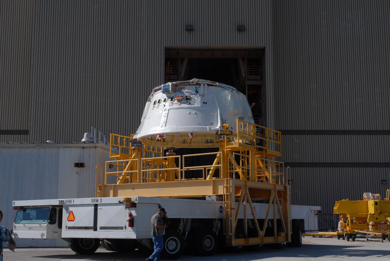 CAPE CANAVERAL, Fla. – The Ares I-X aft skirt moves toward the Rotation, Processing and Surge Facility at NASA's Kennedy Space Center in Florida.  In the RPSF, the aft skirt will be stacked with the aft motor to form the aft assembly.  The complete Ares I-X will be assembled in the Vehicle Assembly Building. The launch of Ares I-X is targeted for August 2009. Photo credit: NASA/Jim Grossmann