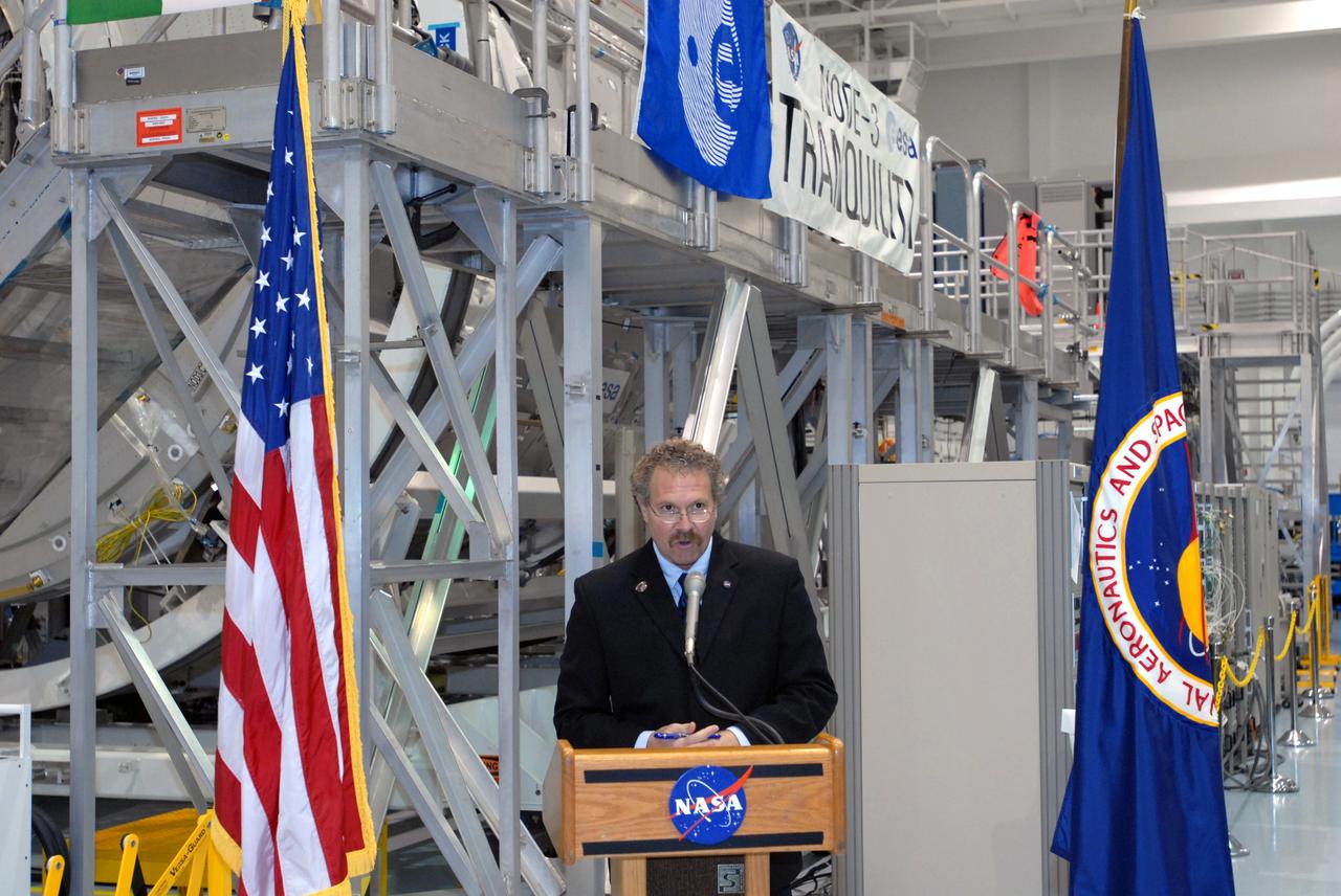 CAPE CANAVERAL, Fla. – Russell Romanella, director of the ISS and Spacecraft Processing Directorate at NASA's Kennedy Space Center, addresses the media who were provided an opportunity to see the newest section of the International Space Station, the Tranquility node, in the Space Station Processing Facility. Tranquility is a pressurized module that will provide room for many of the station's life support systems. Managers from NASA, the European Space Agency, Thales Alenia Space and Boeing -- the organizations involved in building and processing the module for flight -- were available for a question-and-answer session during the event. Tranquility will be delivered to the station during space shuttle Endeavour's STS-130 mission, targeted for launch in February 2010. Photo credit: NASA/Jim Grossmann