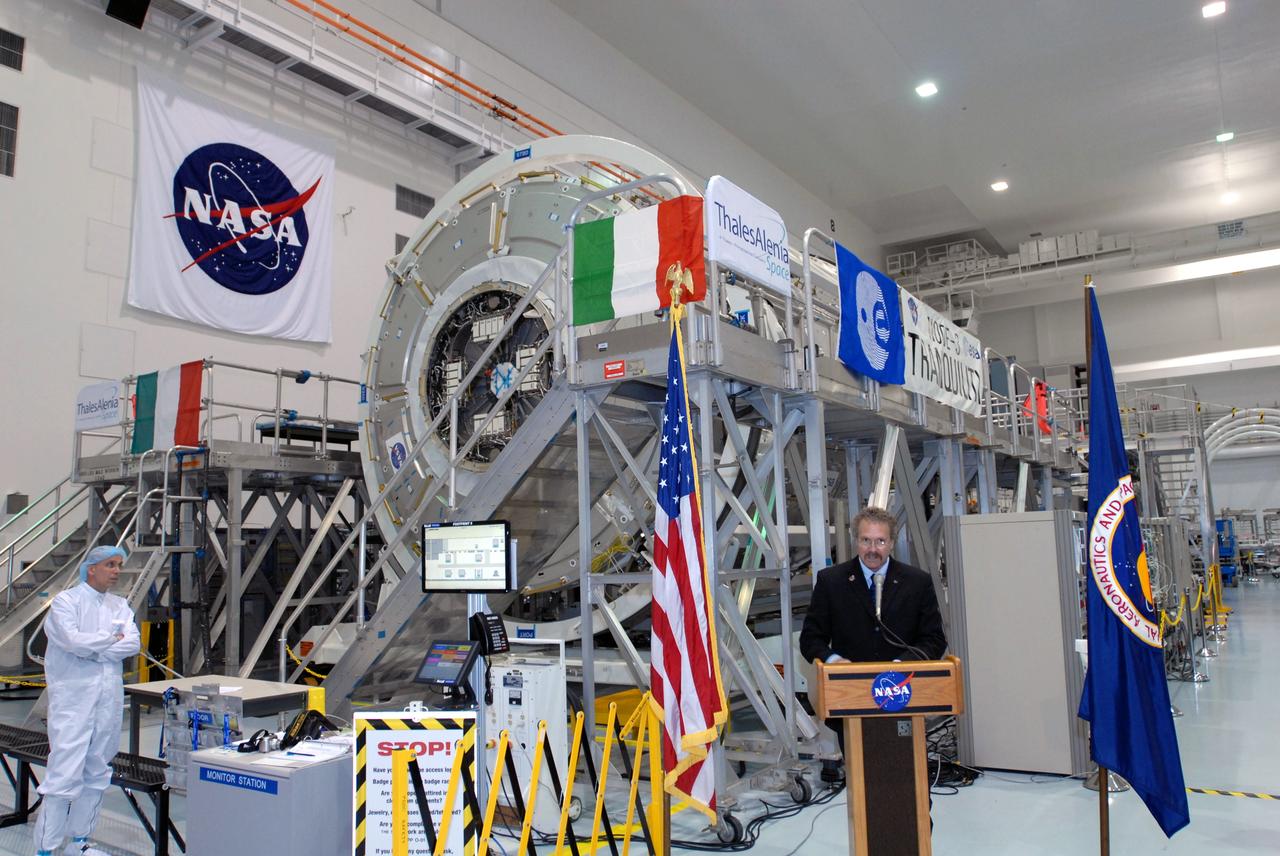 CAPE CANAVERAL, Fla. – Russell Romanella, director of the ISS and Spacecraft Processing Directorate at NASA's Kennedy Space Center, addresses the media who were provided an opportunity to see the newest section of the International Space Station, the Tranquility node, in the Space Station Processing Facility. Tranquility is a pressurized module that will provide room for many of the station's life support systems. Managers from NASA, the European Space Agency, Thales Alenia Space and Boeing -- the organizations involved in building and processing the module for flight -- were available for a question-and-answer session during the event. Tranquility will be delivered to the station during space shuttle Endeavour's STS-130 mission, targeted for launch in February 2010. Photo credit: NASA/Jim Grossmann