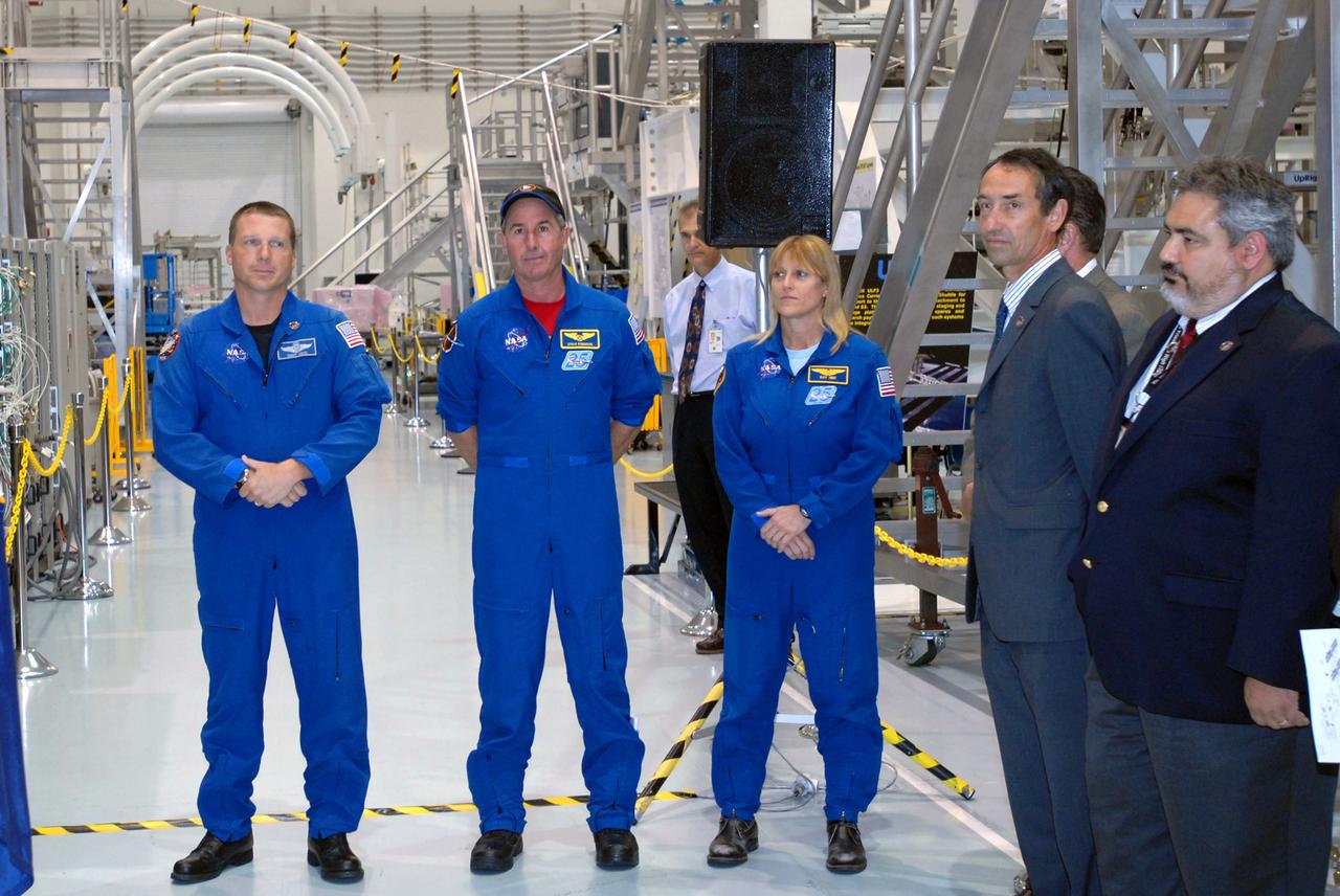 CAPE CANAVERAL, Fla. – During a media event in the Space Station Processing Facility at NASA's Kennedy Space Center in Florida to showcase the newest section of the International Space Station, the Tranquility node, astronauts who will deliver the node on the STS-130 mission were available for questions. From left are Pilot Terry Virts and Mission Specialists Stephen Robinson and Kathryn Hire. At right are other guests, Philippe Deloo, ISS Nodes project manager with the European Space Agency, and Rafael Garcia, ISS Nodes and Express Logistics Carrier project manager with NASA's Johnson Space Center. Managers from NASA, the European Space Agency, Thales Alenia Space and Boeing -- the organizations involved in building and processing the module for flight -- were available for a question-and-answer session during the event. Tranquility is a pressurized module that will provide room for many of the station's life support systems. Photo credit: NASA/Jim Grossmann