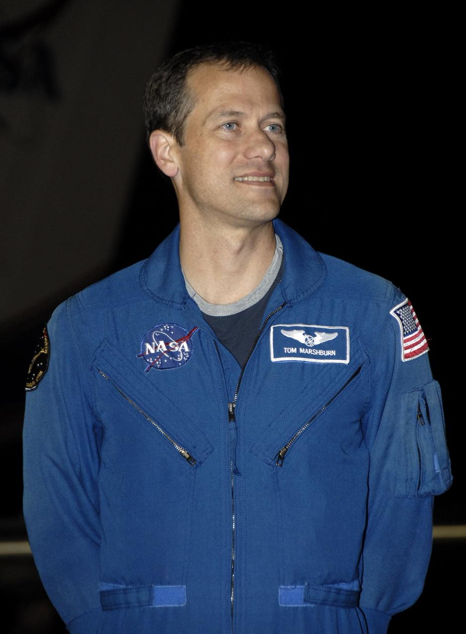 CAPE CANAVERAL, Fla. – At the Shuttle Landing Facility, STS-127 Mission Specialist Tom Marshburn is greeted by the media and others on hand to welcome the STS-127 crew to NASA's Kennedy Space Center in Florida. Marshburn and the other members of the crew arrived from Houston aboard a Shuttle Training Aircraft to get ready for launch on space shuttle Endeavour on June 13.  Marshburn, a former NASA flight surgeon, is making his first shuttle flight. The STS-127 mission is the final of three flights dedicated to the assembly of the Japan Aerospace Exploration Agency's Kibo laboratory complex on the International Space Station.  Endeavour will deliver the Japanese Experiment Module's Exposed Facility, or JEM-EF, and the Experiment Logistics Module-Exposed Section, or ELM-ES, to the space station on STS-127.  Photo credit: NASA/Kim Shiflett